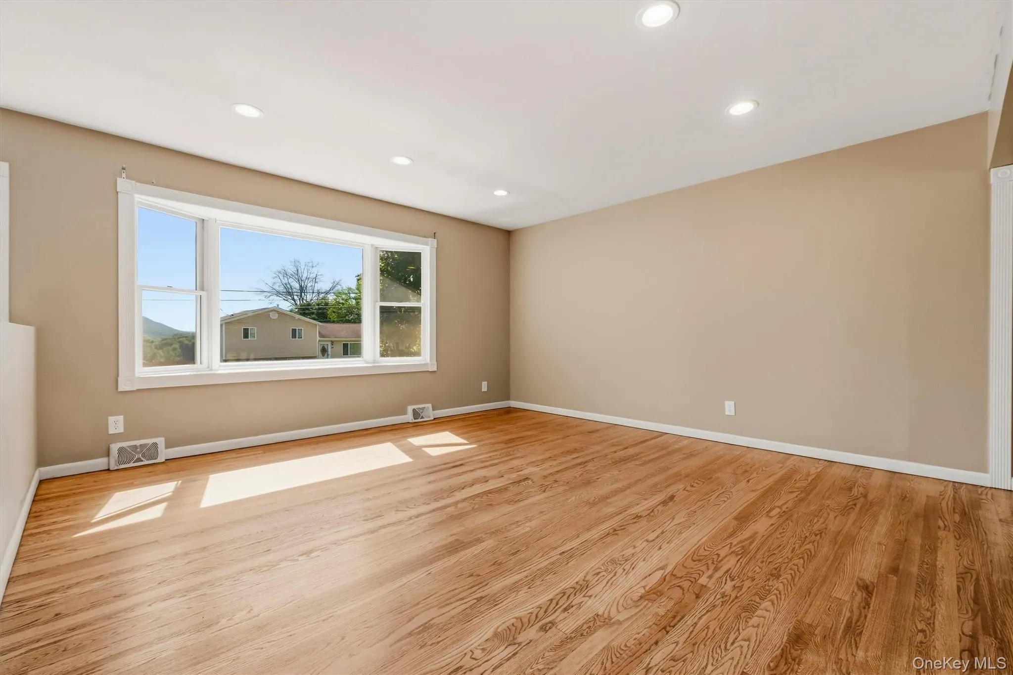 Gleaming, newly refinished hardwood flooring accents the main level. Gleaming, newly refinished hardwood flooring accents the main level.