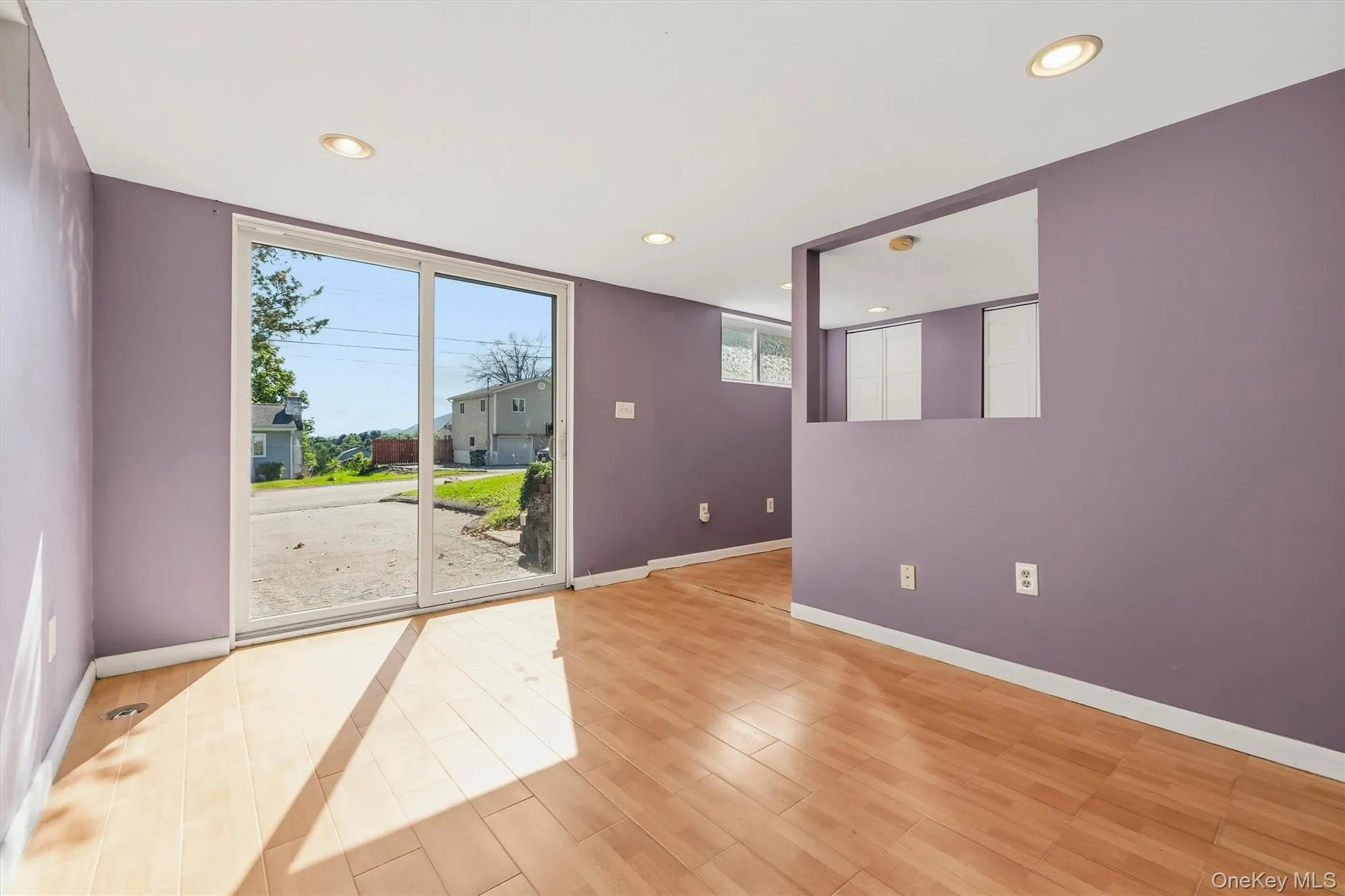 Large recreation room on lower level with sliding glass door to the front of the home. Large recreation room on lower level with sliding glass door to the front of the home.