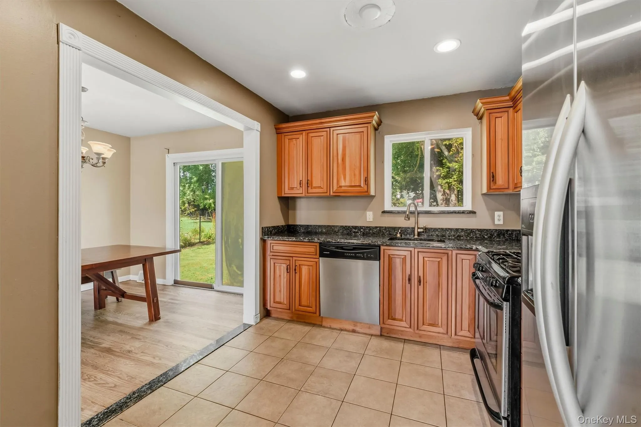 The kitchen is accented with tile flooring and granite countertops. The kitchen is accented with tile flooring and granite countertops.