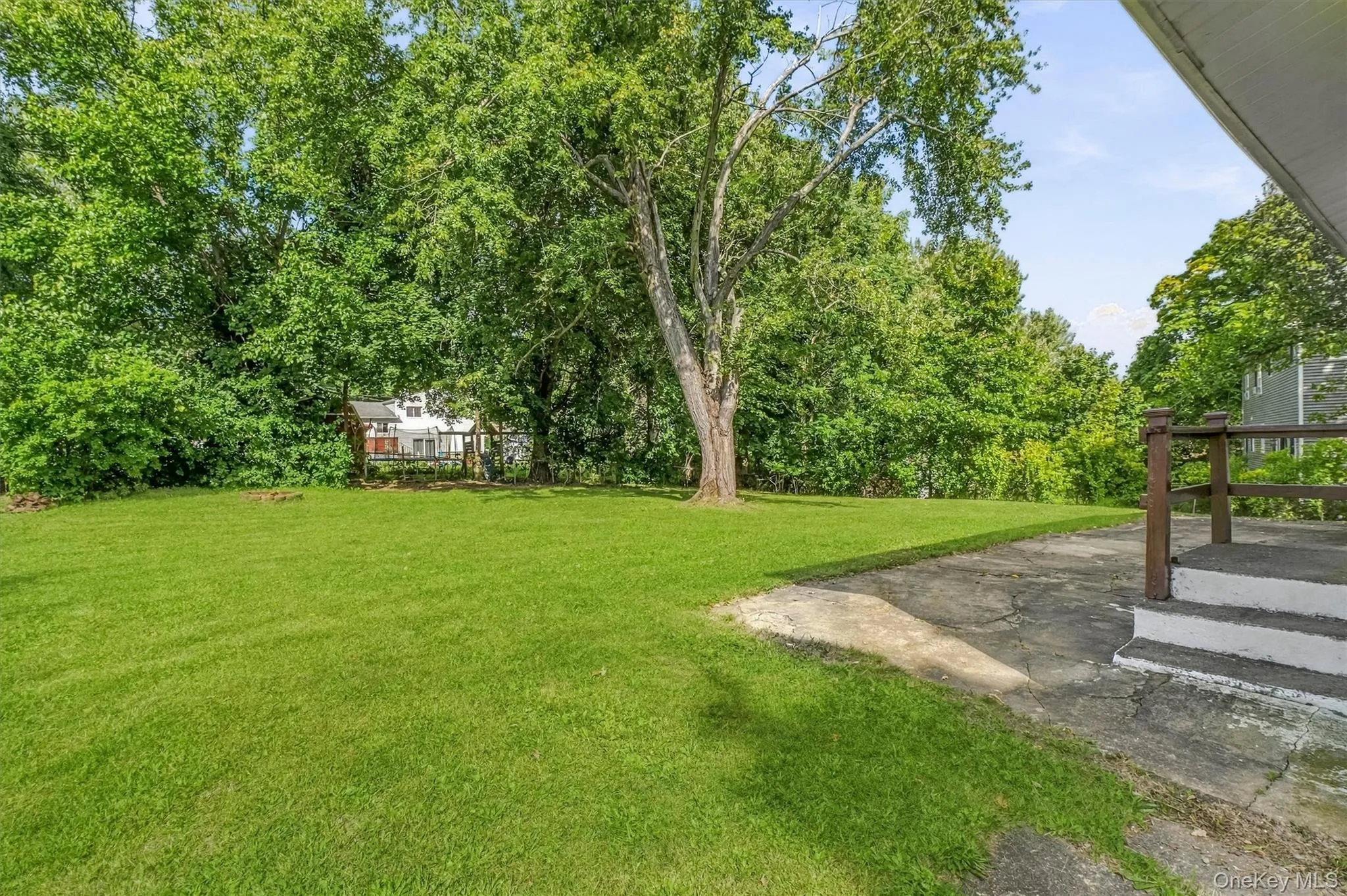 Sprawling yard with mature tress for privacy. Sprawling yard with mature tress for privacy.