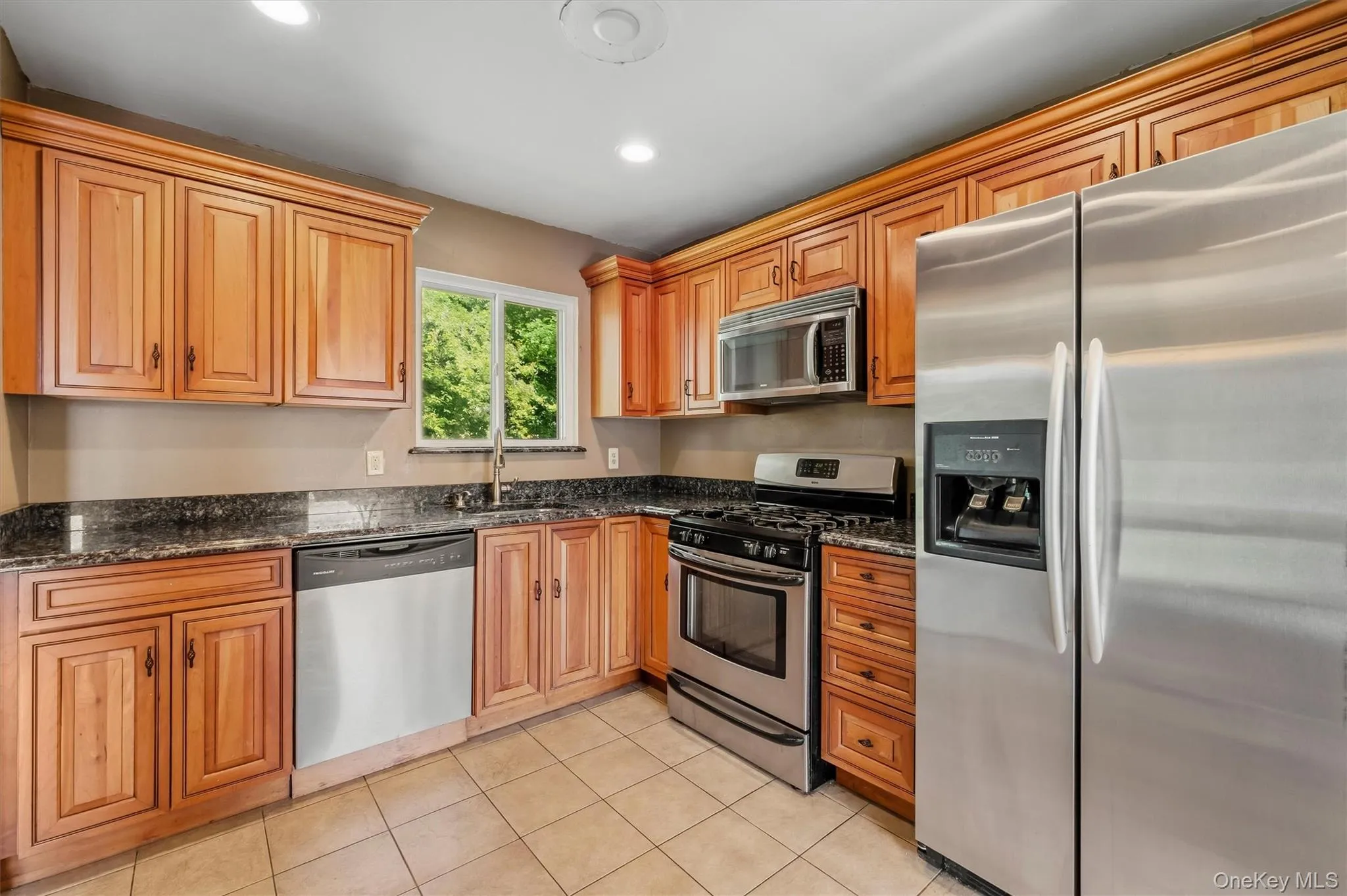 Updated eat in kitchen accented with stainless steel appliances. Updated eat in kitchen accented with stainless steel appliances.