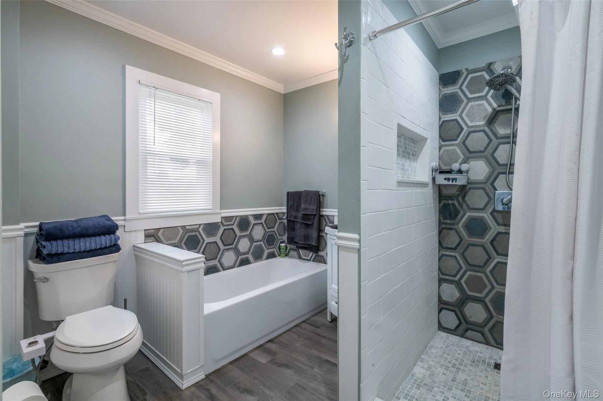 Spacious bathroom with separate tub and shower stall. Spacious bathroom with separate tub and shower stall.