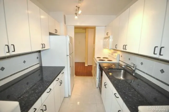 Updated Kitchen with Granite counters, Range, Dishwasher, Microwave and Refrigerator. Updated Kitchen with Granite counters, Range, Dishwasher, Microwave and Refrigerator.