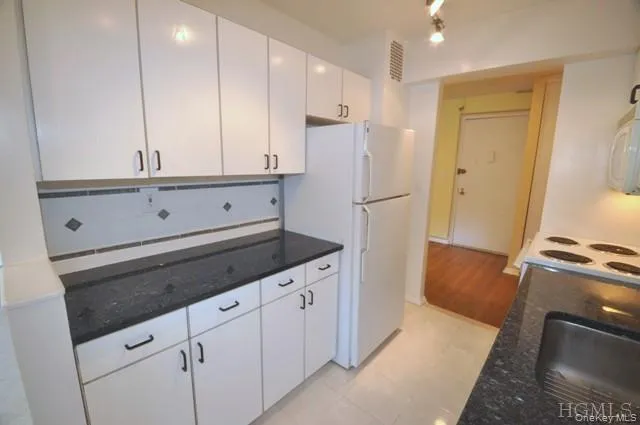 Updated Kitchen with Granite counters, Range, Dishwasher, Microwave and Refrigerator. Updated Kitchen with Granite counters, Range, Dishwasher, Microwave and Refrigerator.