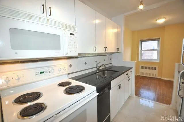 Updated Kitchen with Granite counters, Range, Dishwasher, Microwave and Refrigerator. Updated Kitchen with Granite counters, Range, Dishwasher, Microwave and Refrigerator.