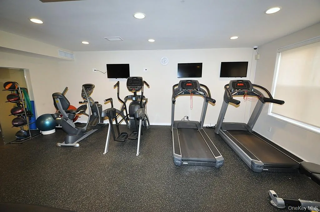 The building exercise room has treadmills, recumbent bikes, free weights and universal machine. The building exercise room has treadmills, recumbent bikes, free weights and universal machine.
