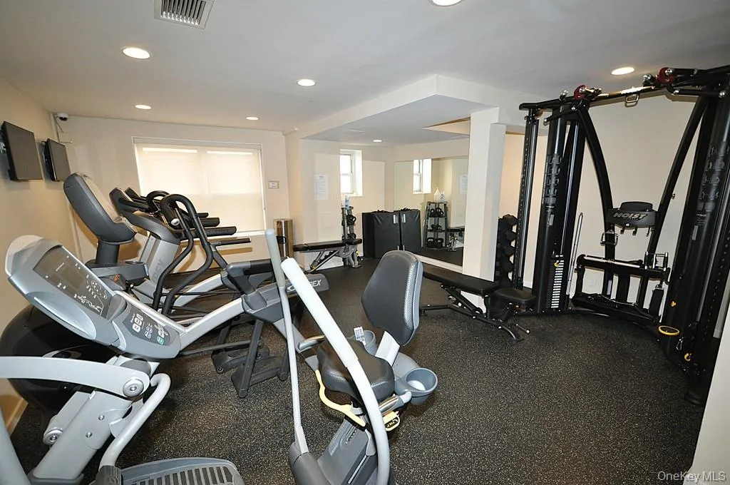 The building exercise room has treadmills, recumbent bikes, free weights and universal machine. The building exercise room has treadmills, recumbent bikes, free weights and universal machine.