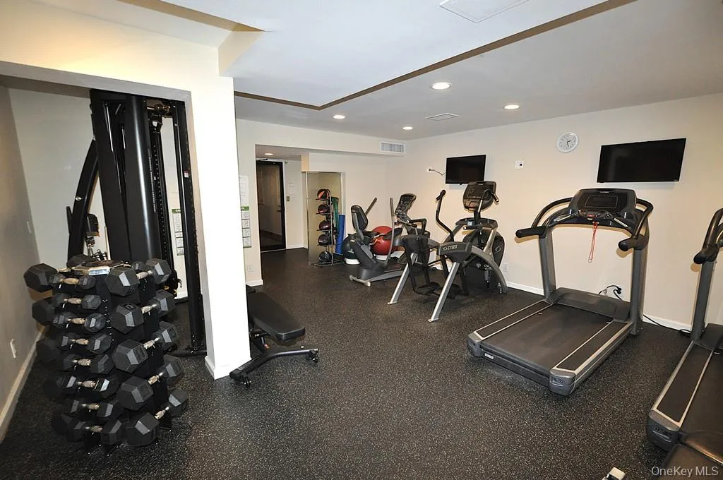 The building exercise room has treadmills, recumbent bikes, free weights and universal machine. The building exercise room has treadmills, recumbent bikes, free weights and universal machine.