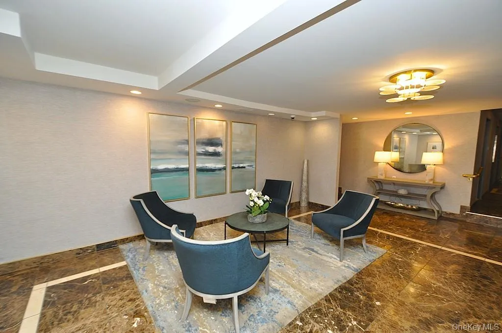 Welcoming lobby provides a comfortable seating area across from the doorman. Welcoming lobby provides a comfortable seating area across from the doorman.