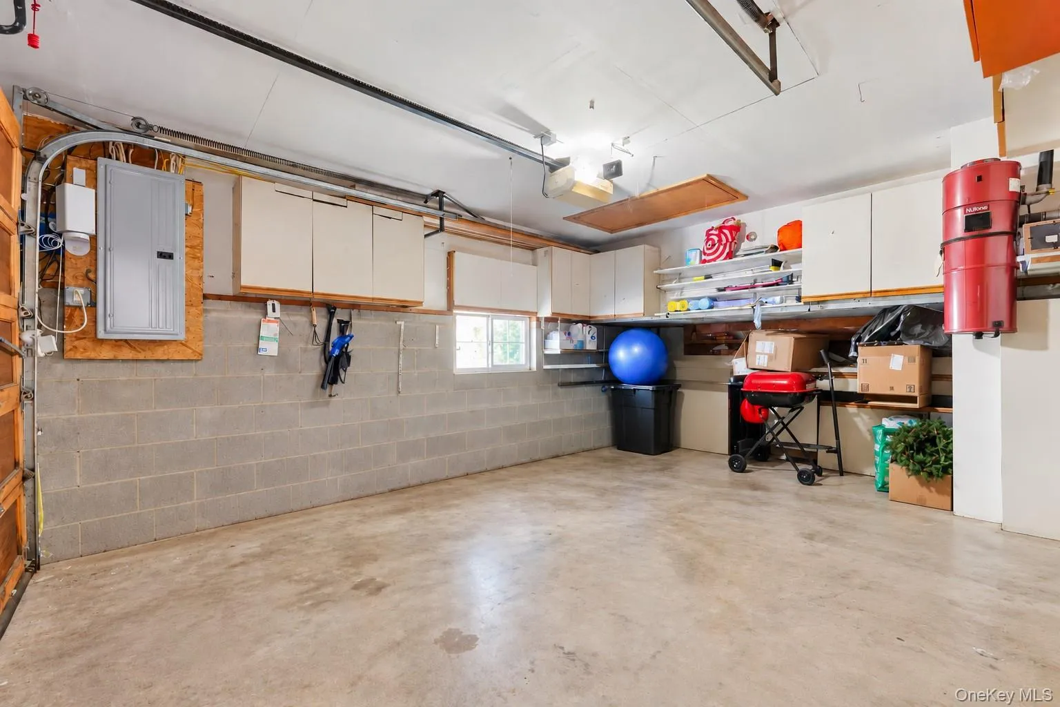Garage with built-in cabinetry, overhead plenty storage with pull down stairs. Garage with built-in cabinetry, overhead plenty storage with pull down stairs.