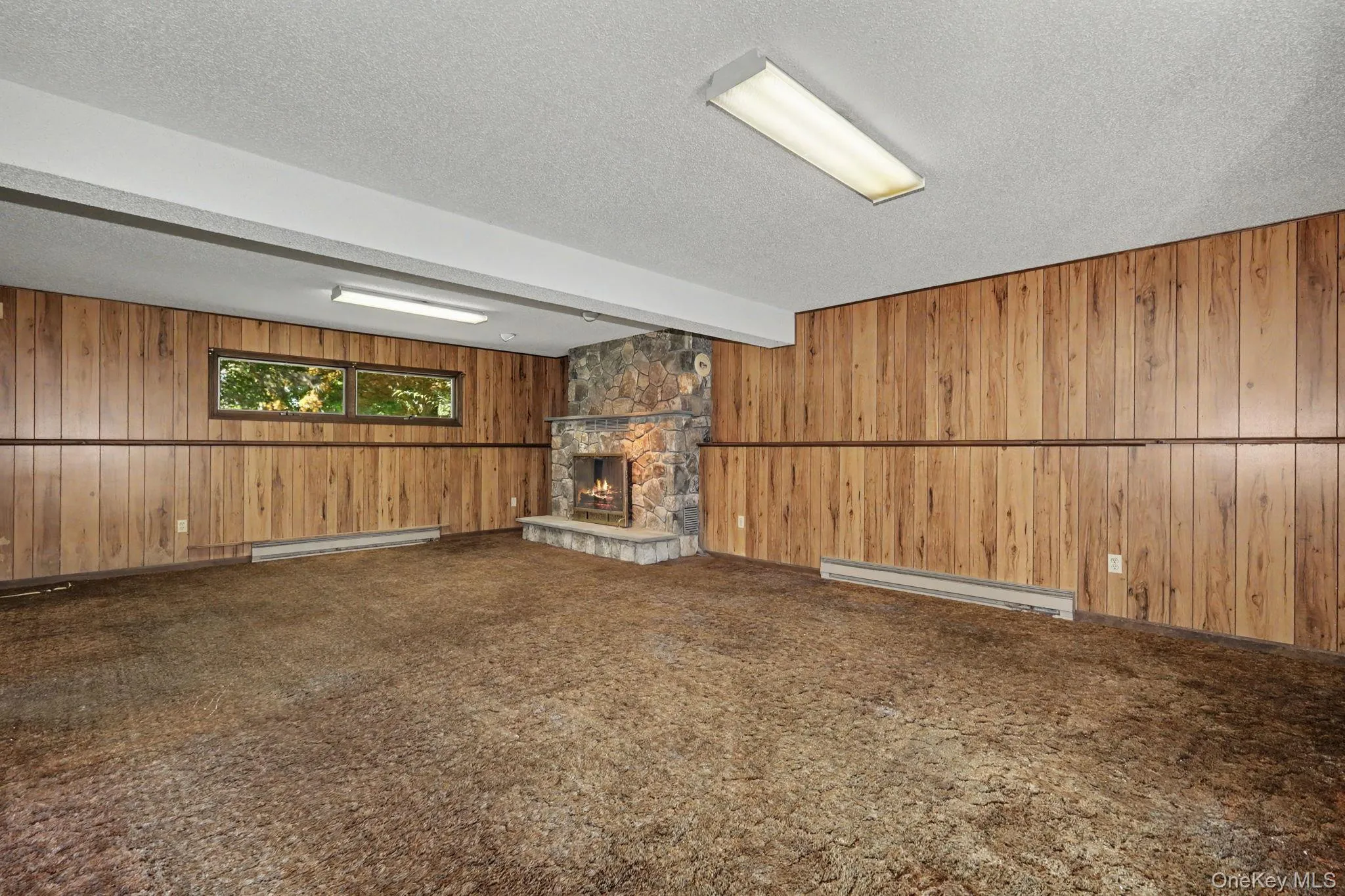 Walkout Family room with woodburning fireplace Walkout Family room with woodburning fireplace