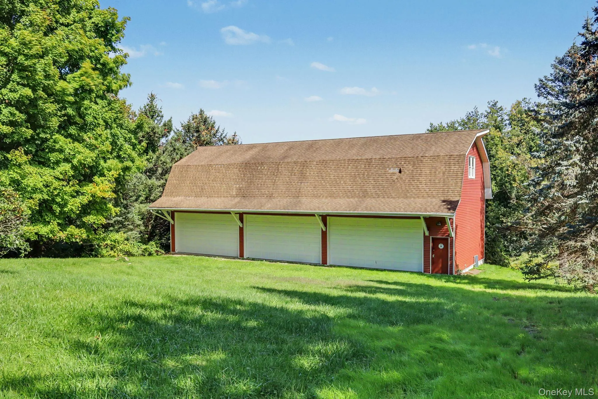 detached three-car garage and barn (70' x 27') and each garage bay is 10' high x 20' wide. Garage and barn has a full pine staircase which leads to the large unfinished second story. Ideal for the car enthusiast, hobbyist, contractor, collector, or anyone looking for exceptional workspace, the barn is equipped with electrical, professional car lifts and offers plenty of room for multiple vehicles, equipment, tools, and storage. detached three-car garage and barn (70' x 27') and each garage bay is 10' high x 20' wide. Garage and barn has a full pine staircase which leads to the large unfinished second story. Ideal for the car enthusiast, hobbyist, contractor, collector, or anyone looking for exceptional workspace, the barn is equipped with electrical, professional car lifts and offers plenty of room for multiple vehicles, equipment, tools, and storage.