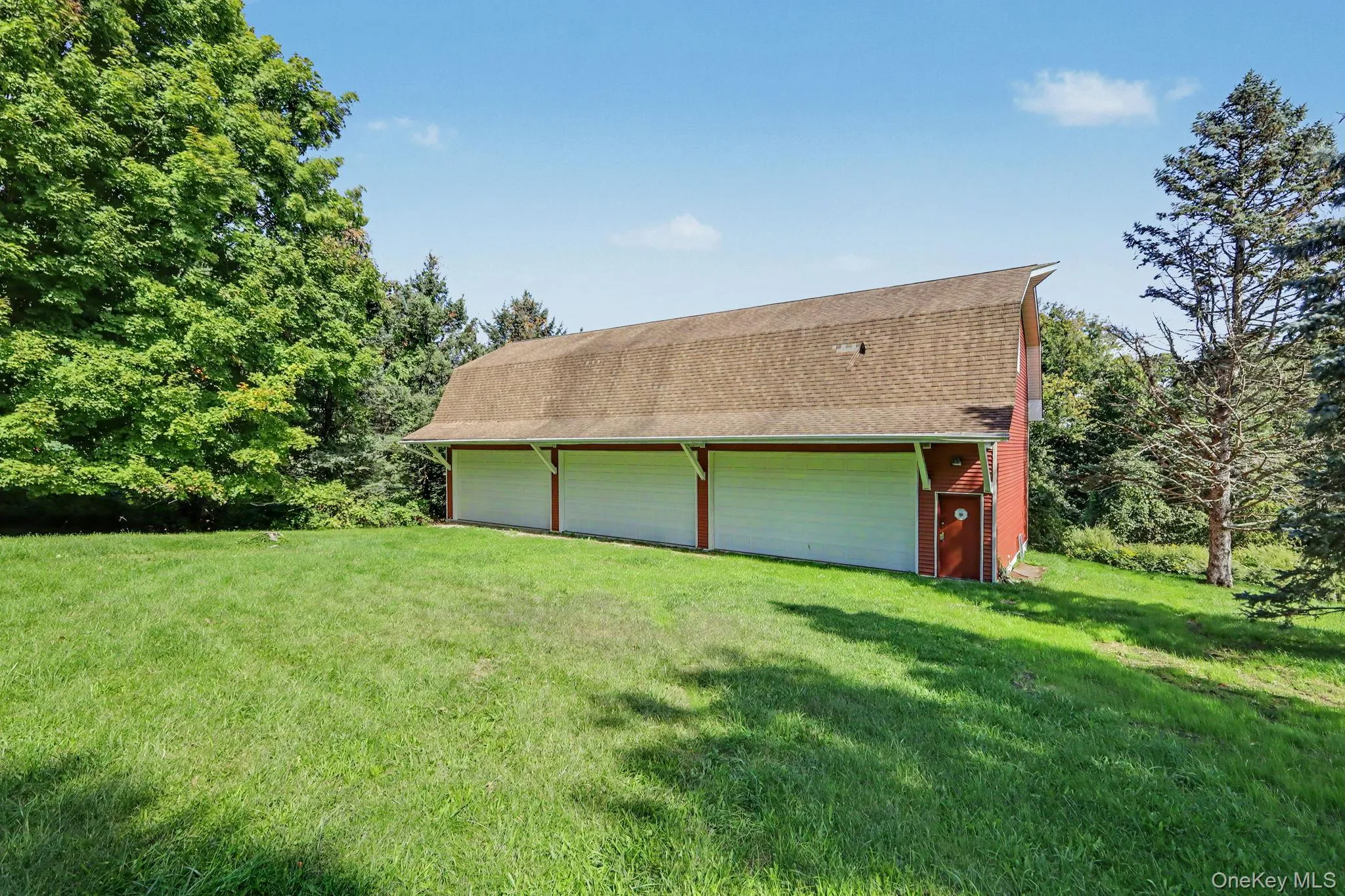 detached three-car garage and barn (70' x 27') and each garage bay is 10' high x 20' wide. Garage and barn has a full pine staircase which leads to the large unfinished second story. Ideal for the car enthusiast, hobbyist, contractor, collector, or anyone looking for exceptional workspace, the barn is equipped with electrical, professional car lifts and offers plenty of room for multiple vehicles, equipment, tools, and storage. detached three-car garage and barn (70' x 27') and each garage bay is 10' high x 20' wide. Garage and barn has a full pine staircase which leads to the large unfinished second story. Ideal for the car enthusiast, hobbyist, contractor, collector, or anyone looking for exceptional workspace, the barn is equipped with electrical, professional car lifts and offers plenty of room for multiple vehicles, equipment, tools, and storage.