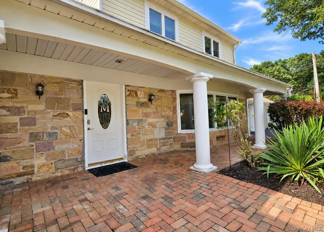 Brick paver entryway with stone facade accents Brick paver entryway with stone facade accents