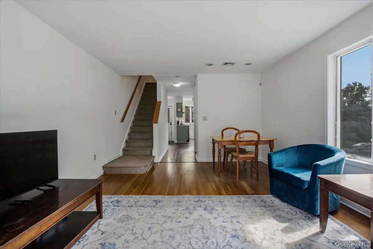 Sun filled living room with dining alcove. Sun filled living room with dining alcove.
