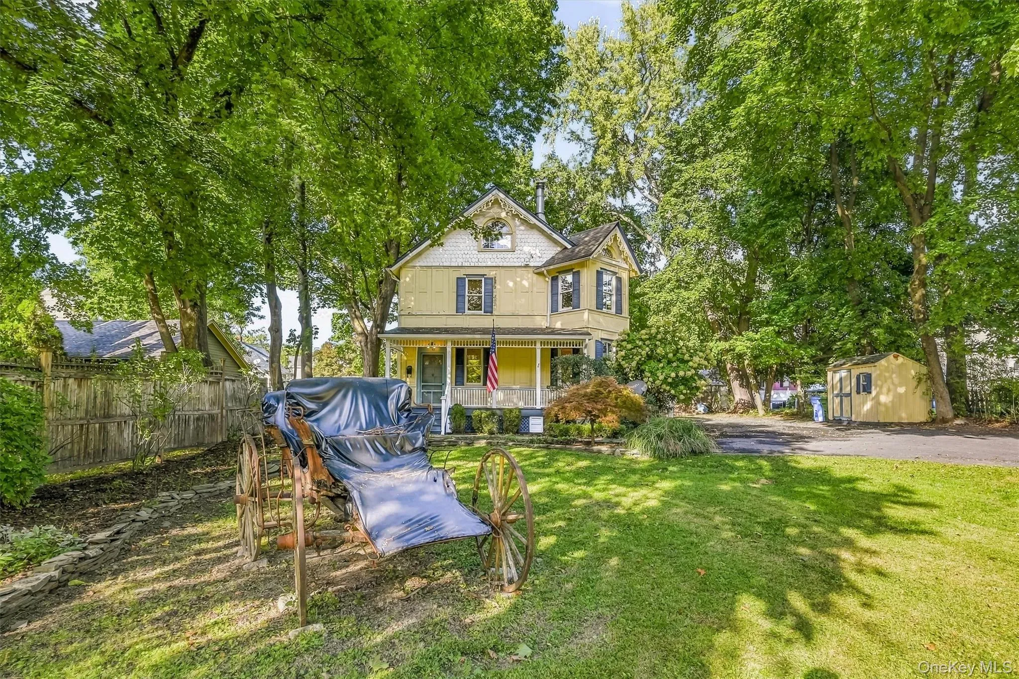 Charming exterior surrounded by mature trees and a spacious yard Charming exterior surrounded by mature trees and a spacious yard