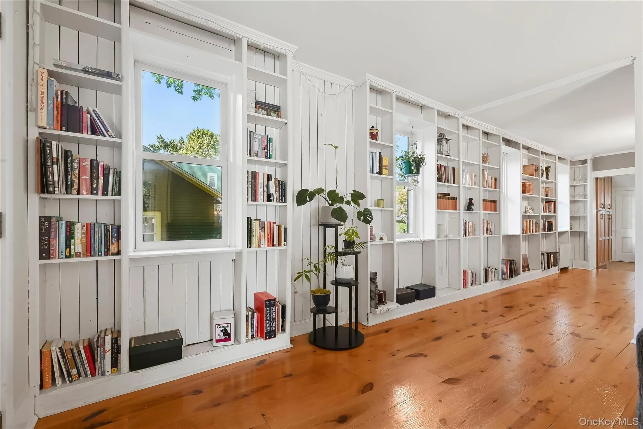 Floor-to-ceiling bookshelves add character and storage to the main living space Floor-to-ceiling bookshelves add character and storage to the main living space