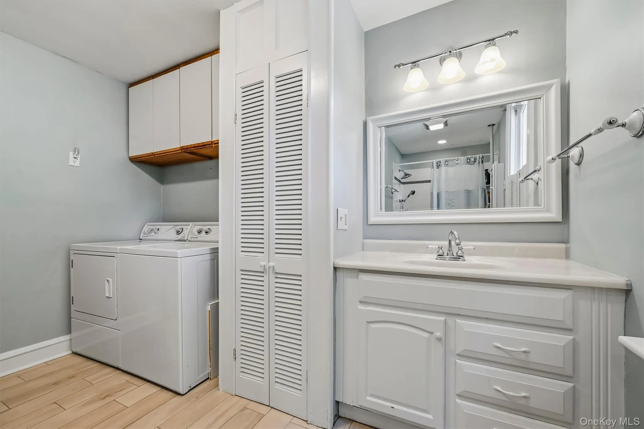 Full bathroom with convenient laundry area Full bathroom with convenient laundry area