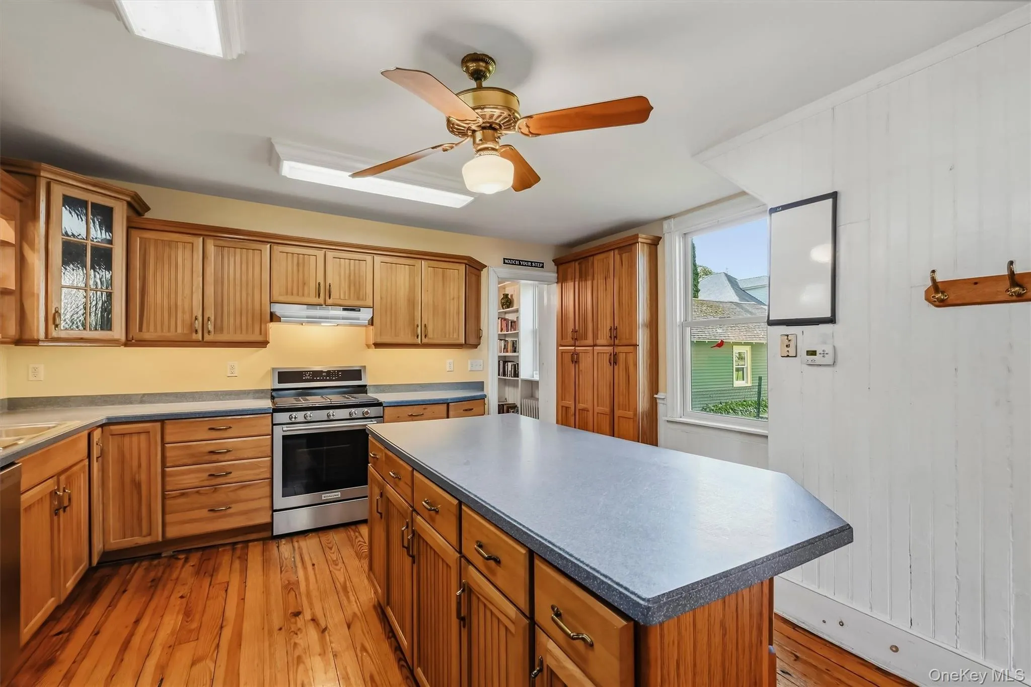 Generous kitchen offering extensive cabinetry, counter space and a large center island Generous kitchen offering extensive cabinetry, counter space and a large center island