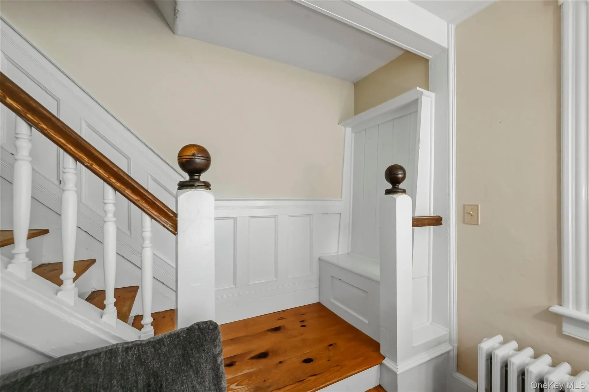 A unique pew incorporated into the staircase reflects the home’s history A unique pew incorporated into the staircase reflects the home’s history