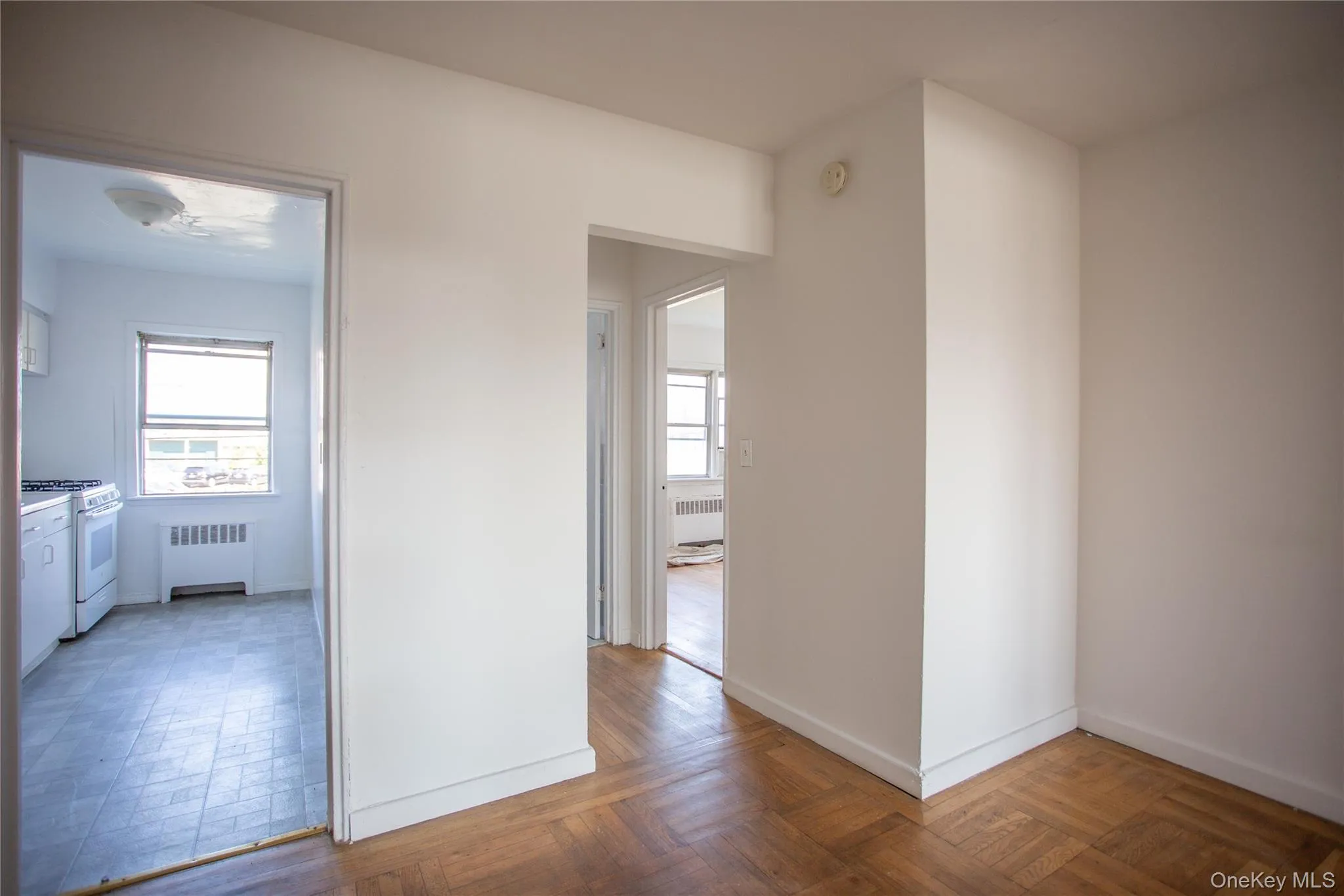 Hallway featuring radiator heating unit Hallway featuring radiator heating unit