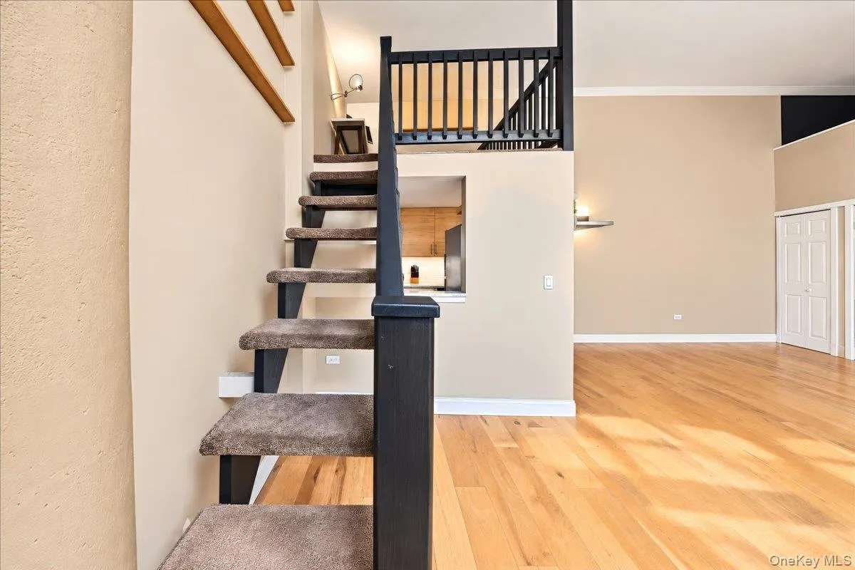 Separate stairs to the bonus room loft Separate stairs to the bonus room loft