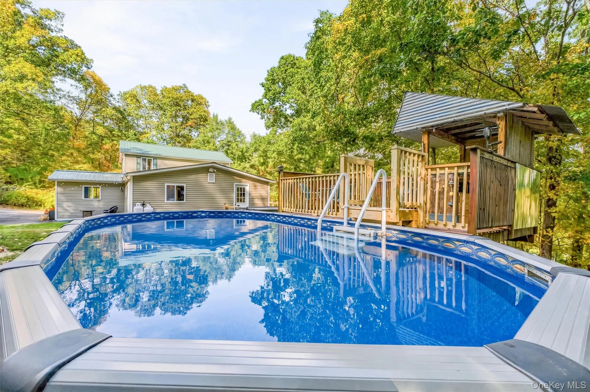 above - ground swimming pool featuring a classic blue interior, vinyl liner construction, and integrated deck decking above - ground swimming pool featuring a classic blue interior, vinyl liner construction, and integrated deck decking