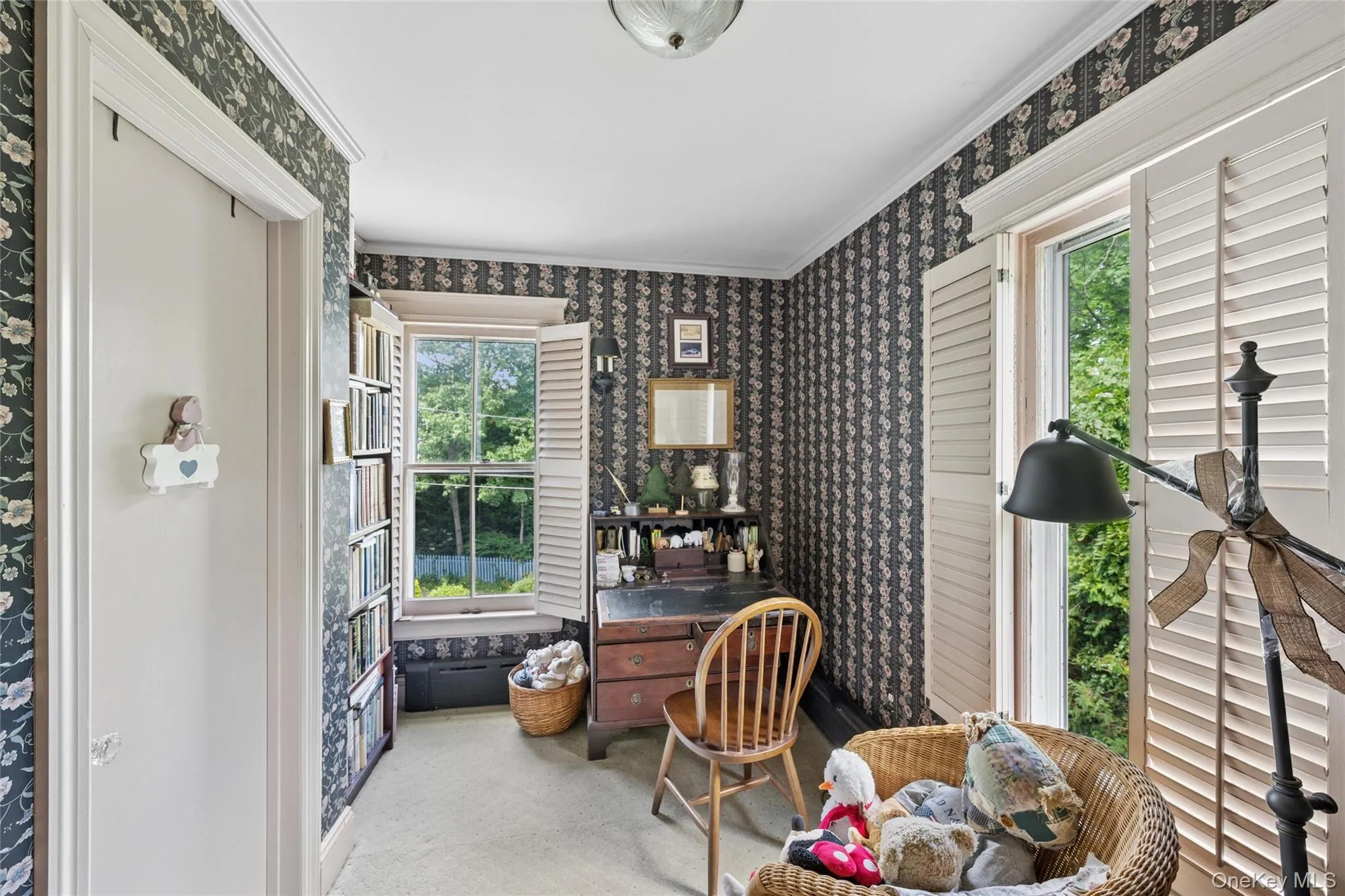 Primary bedroom office nook with entrance to bathroom Primary bedroom office nook with entrance to bathroom