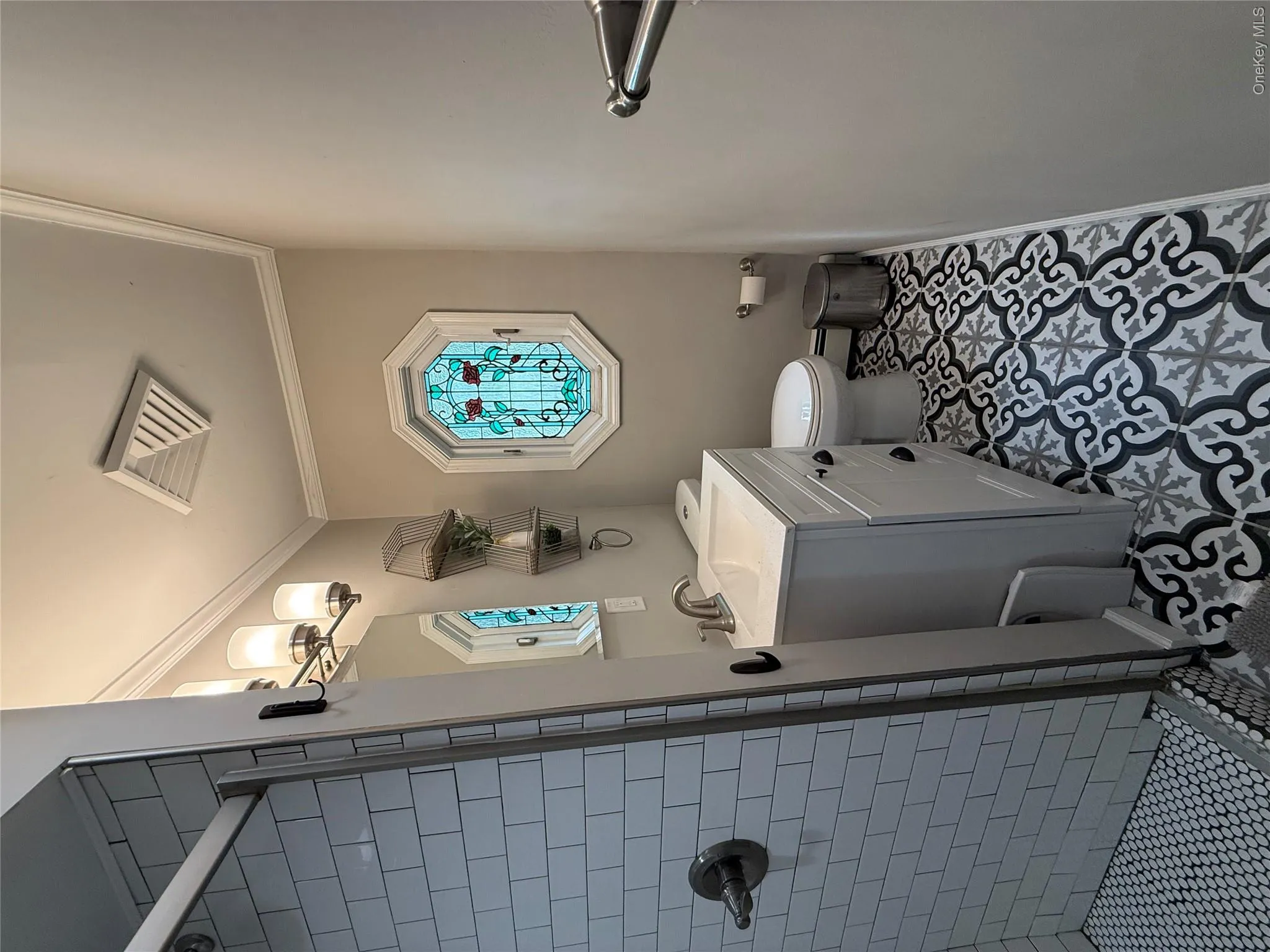 Full bathroom with stain glass window Full bathroom with stain glass window
