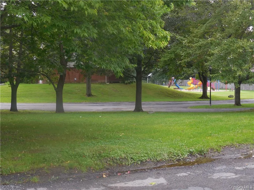 View of community featuring a yard View of community featuring a yard