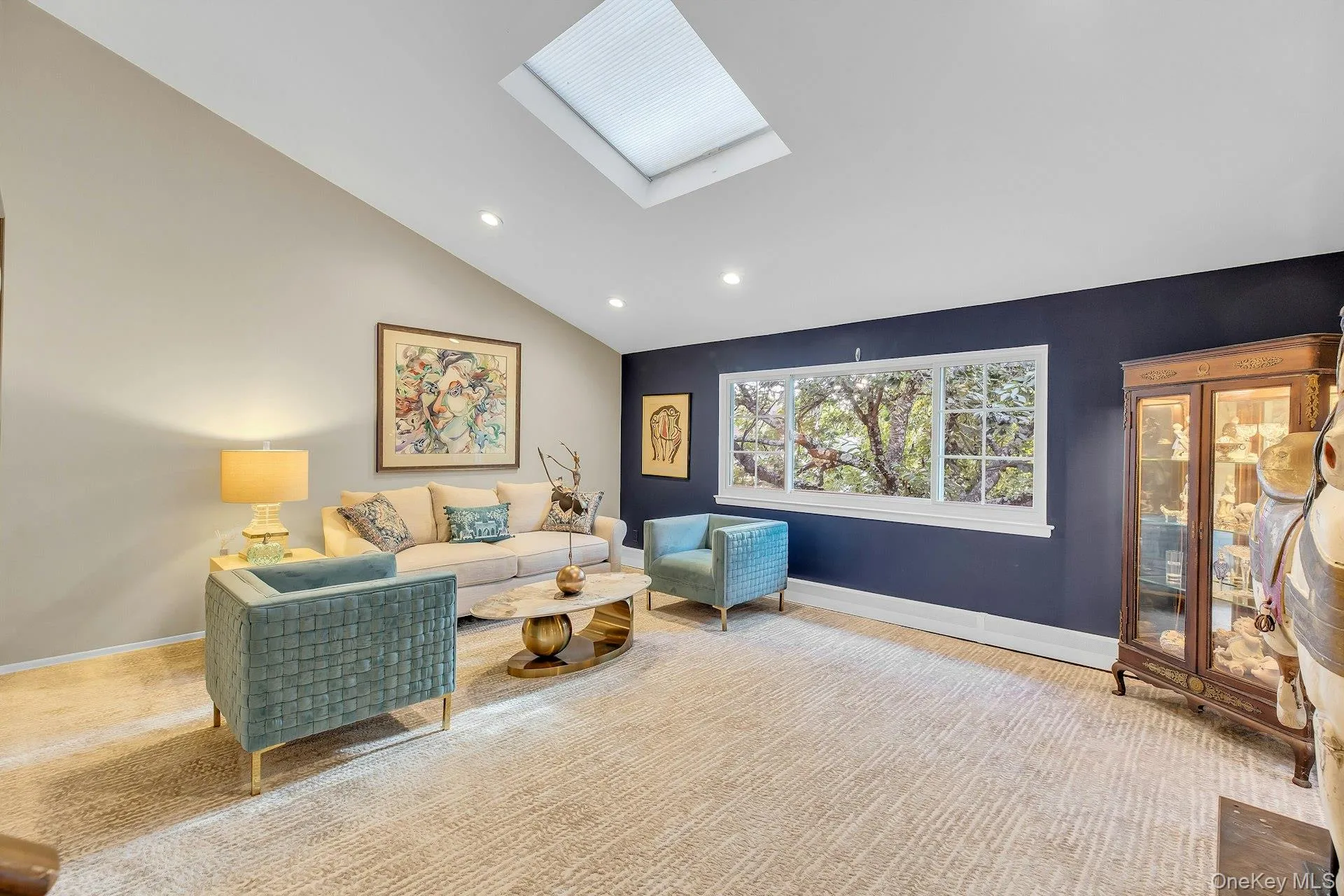 Vaulted ceiling with skylight, recessed lighting, and large bay window. Vaulted ceiling with skylight, recessed lighting, and large bay window.