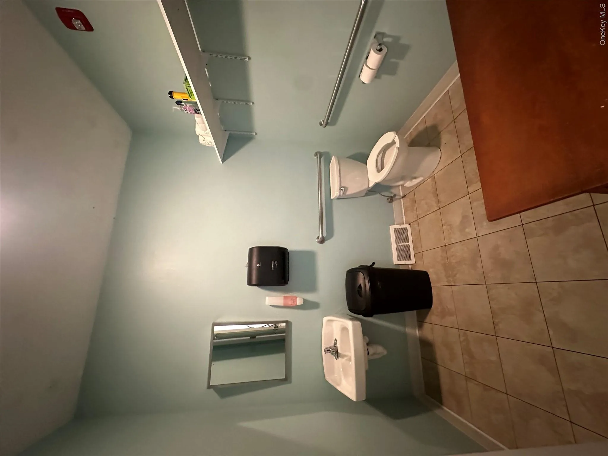 Half bath with light tile patterned flooring and baseboards Half bath with light tile patterned flooring and baseboards