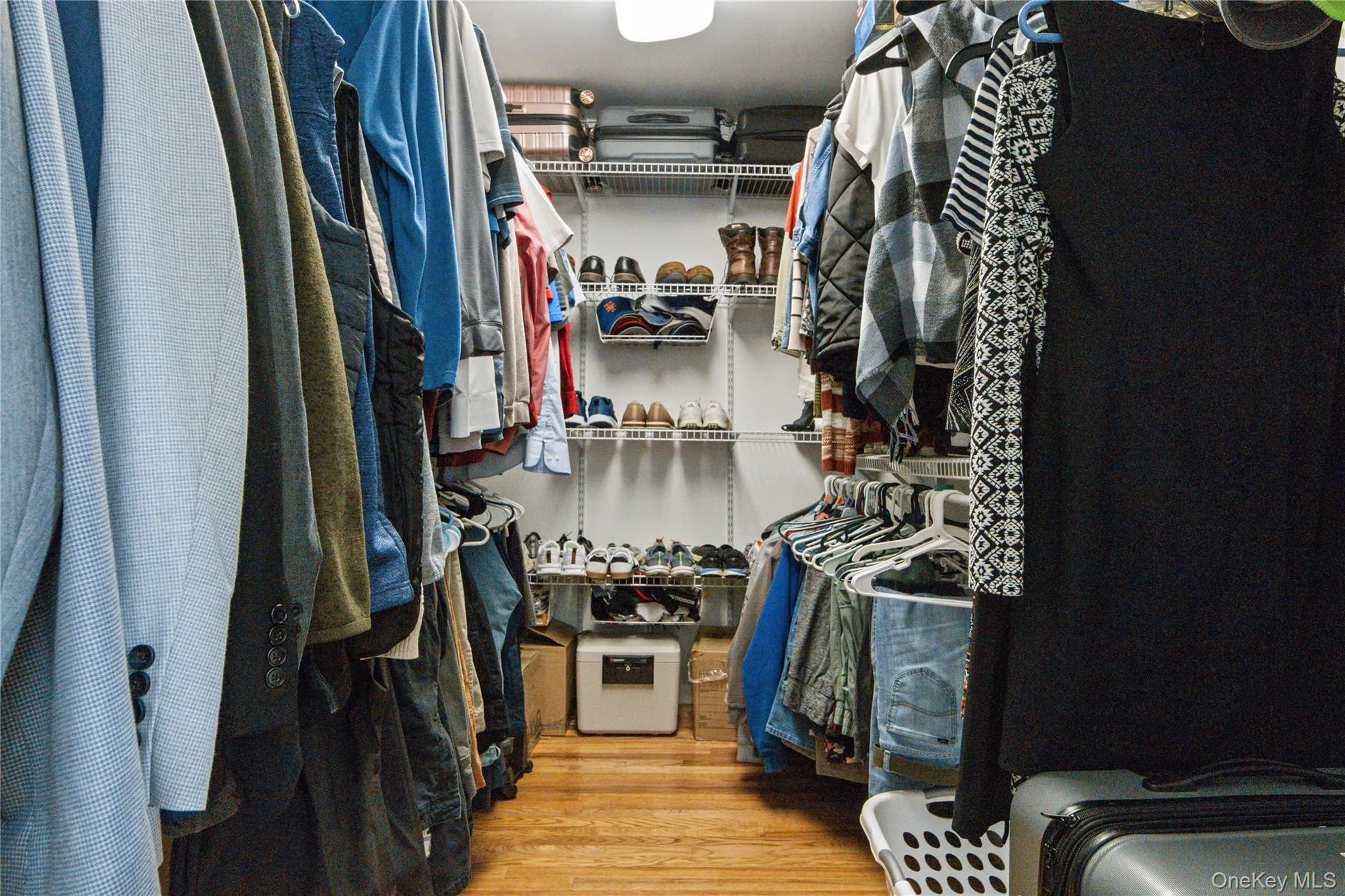 Primary Walk in closet with built ins for organization Primary Walk in closet with built ins for organization
