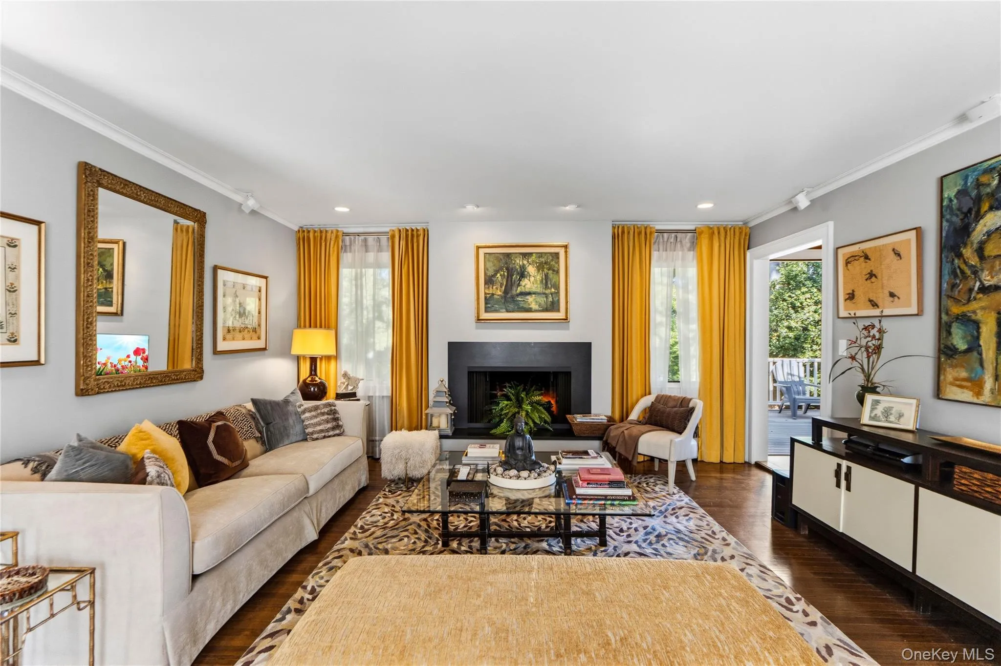 Living area featuring hardwood flooring, recessed lighting Living area featuring hardwood flooring, recessed lighting