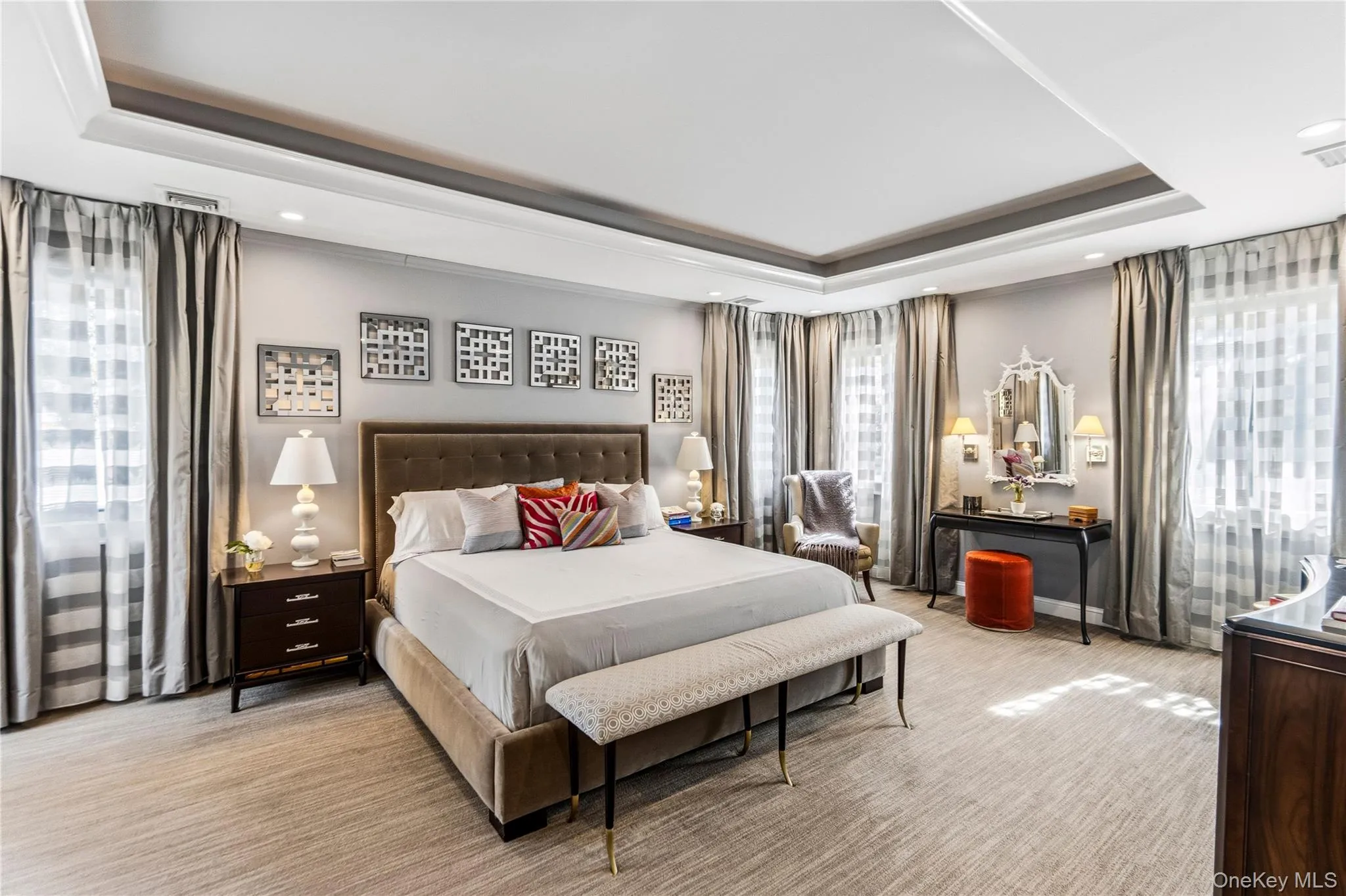 Tray ceiling with recessed lighting and neutral carpeting Tray ceiling with recessed lighting and neutral carpeting