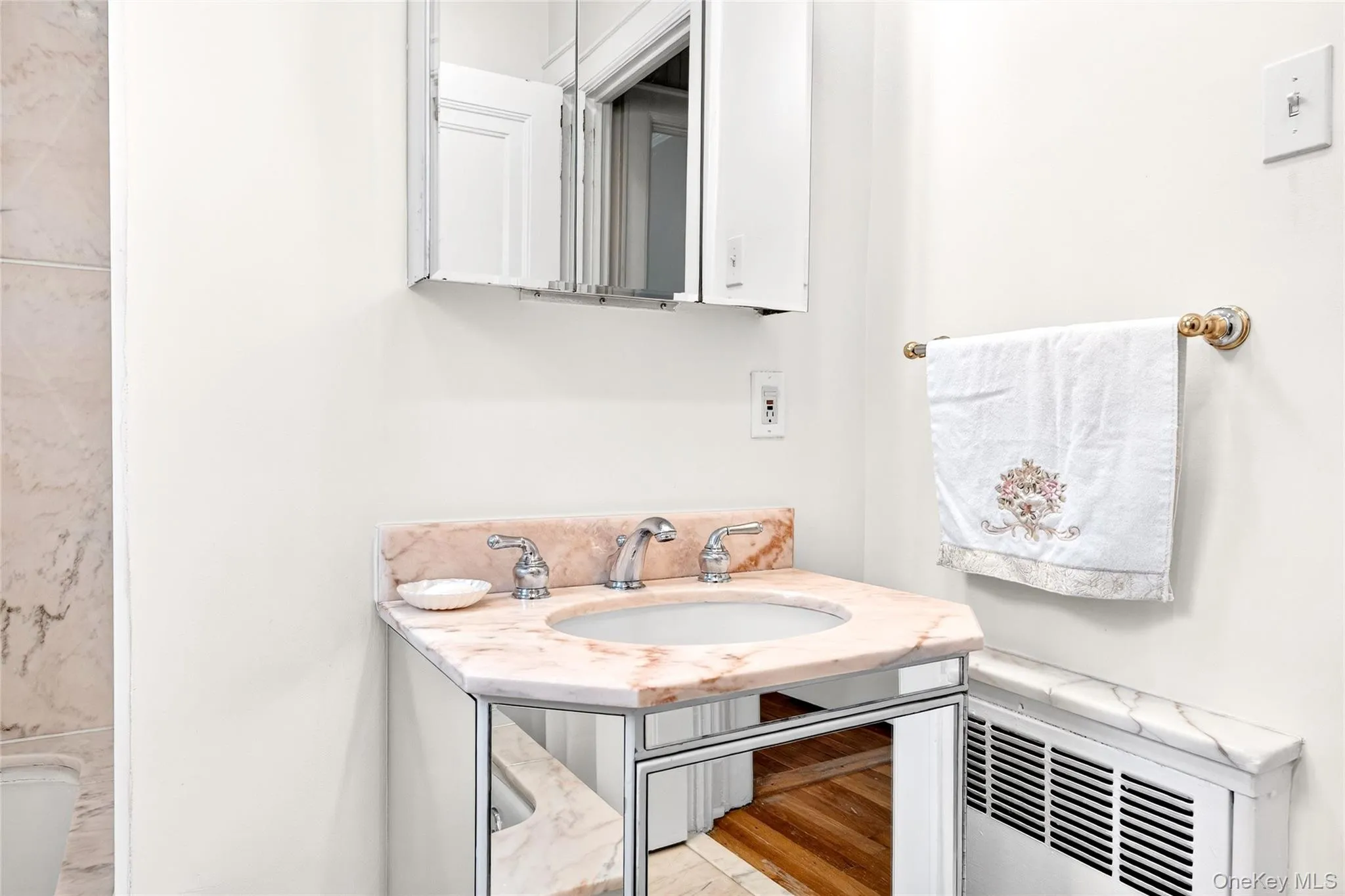 Full bath with a sink and radiator Full bath with a sink and radiator