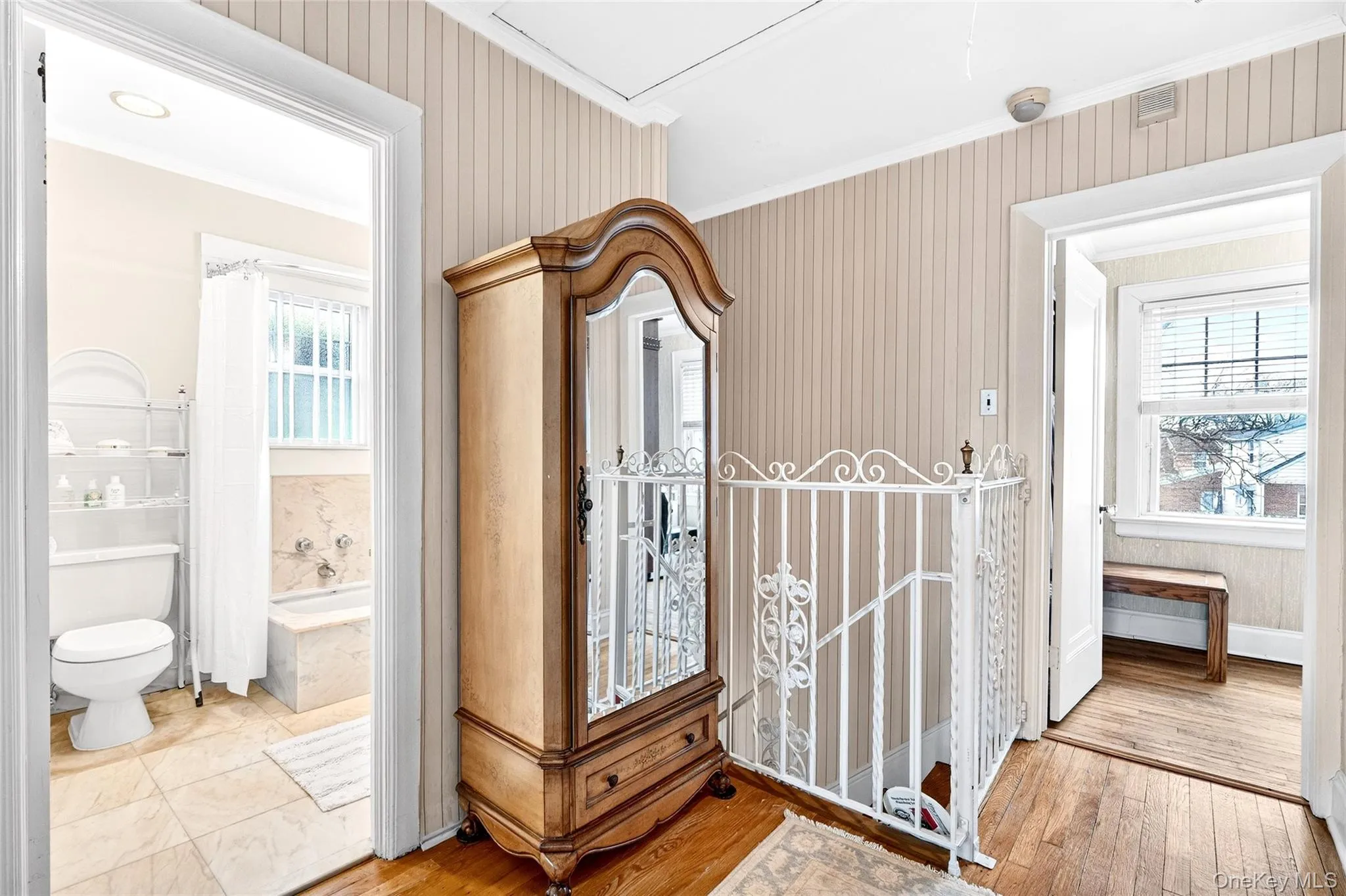 Corridor with ornamental molding and light wood-type flooring Corridor with ornamental molding and light wood-type flooring