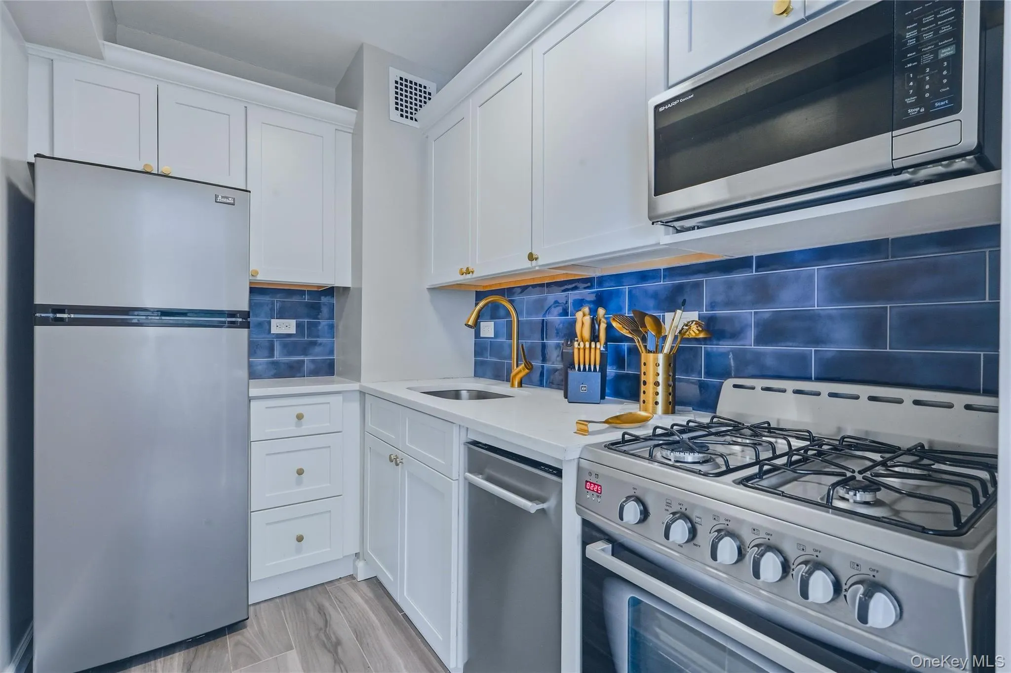 Updated gourmet kitchen with stainless appliances and quartz countertops. Updated gourmet kitchen with stainless appliances and quartz countertops.