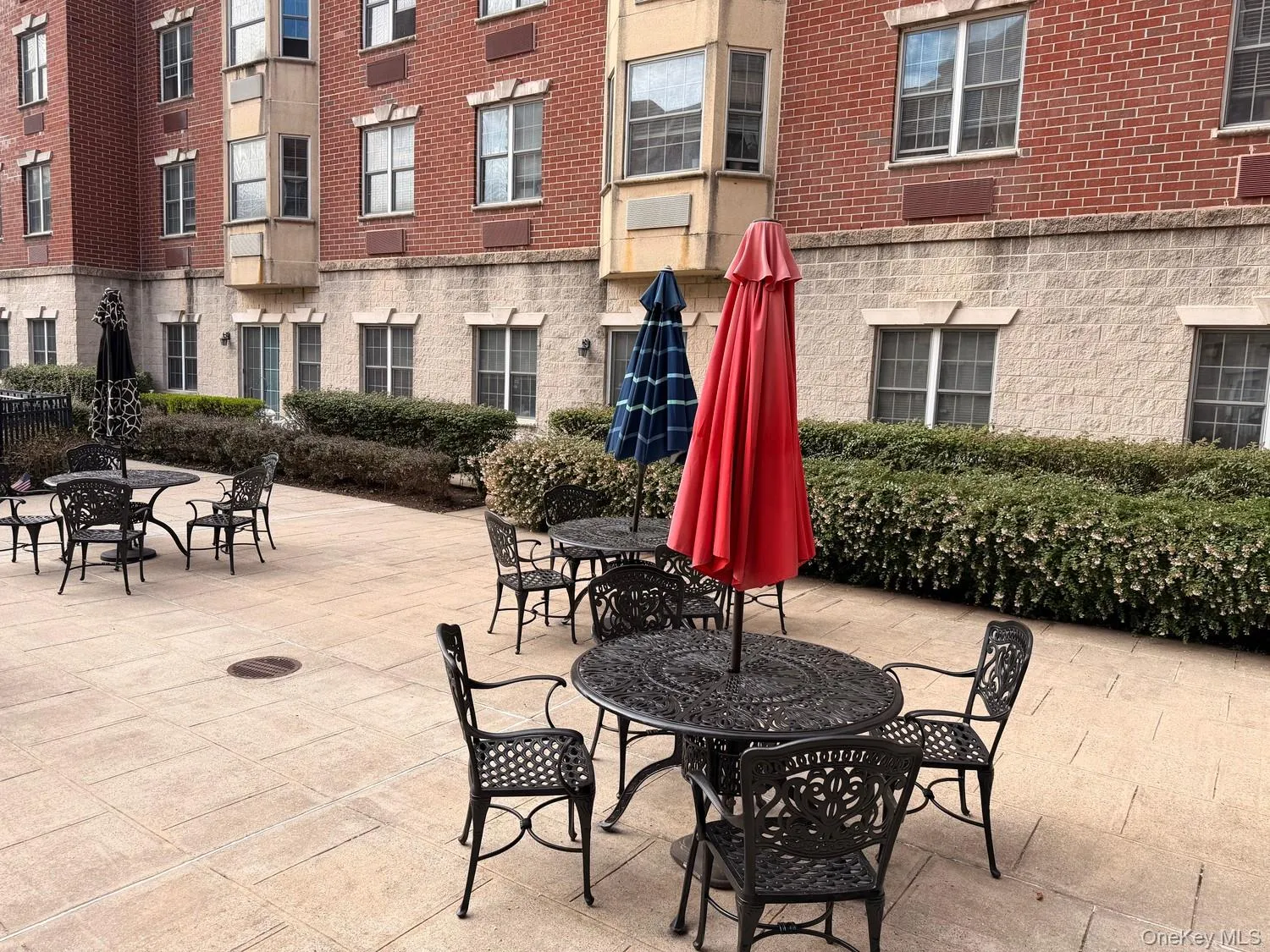 Courtyard patio with tables and shade umbrellas Courtyard patio with tables and shade umbrellas