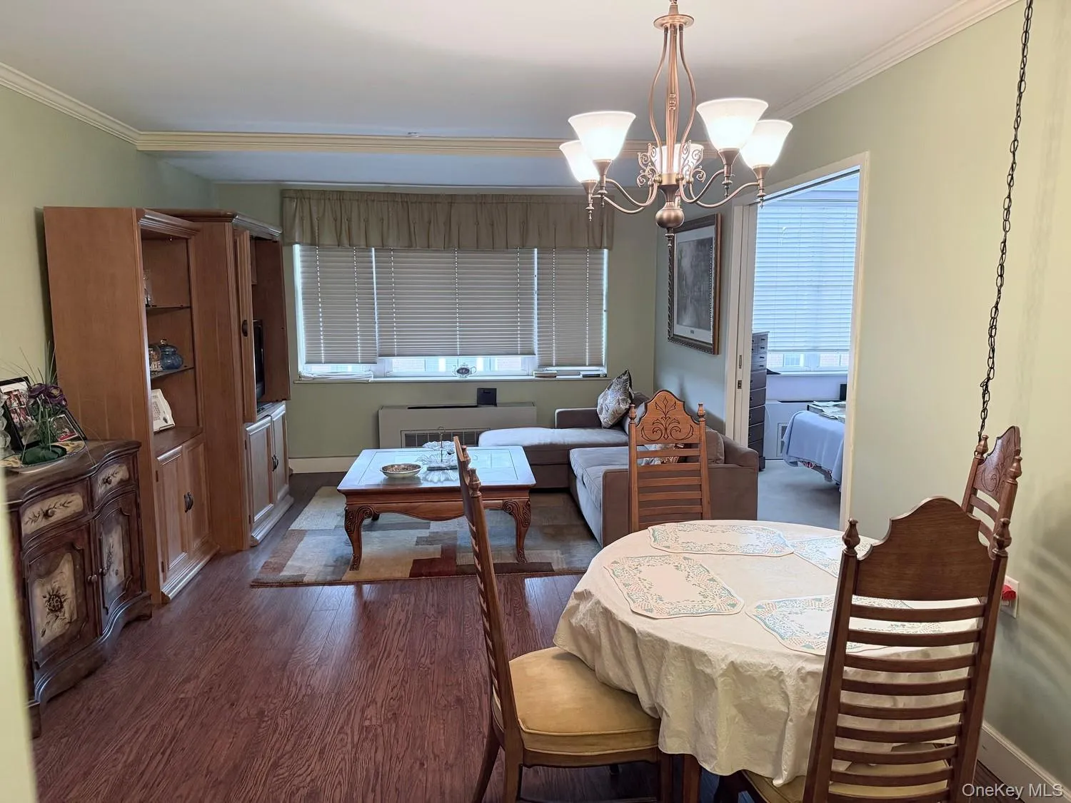 Spacious open layout living room/dining room with view of the courtyard and heated swimming pool Spacious open layout living room/dining room with view of the courtyard and heated swimming pool