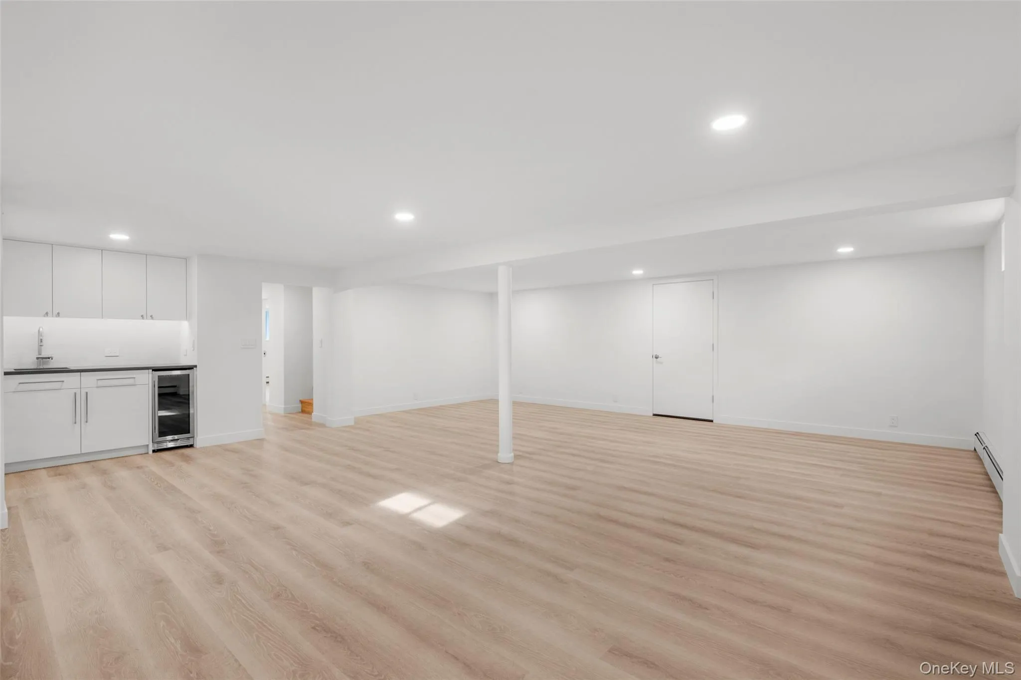 Finished basement with wet bar and engineered wood floors Finished basement with wet bar and engineered wood floors