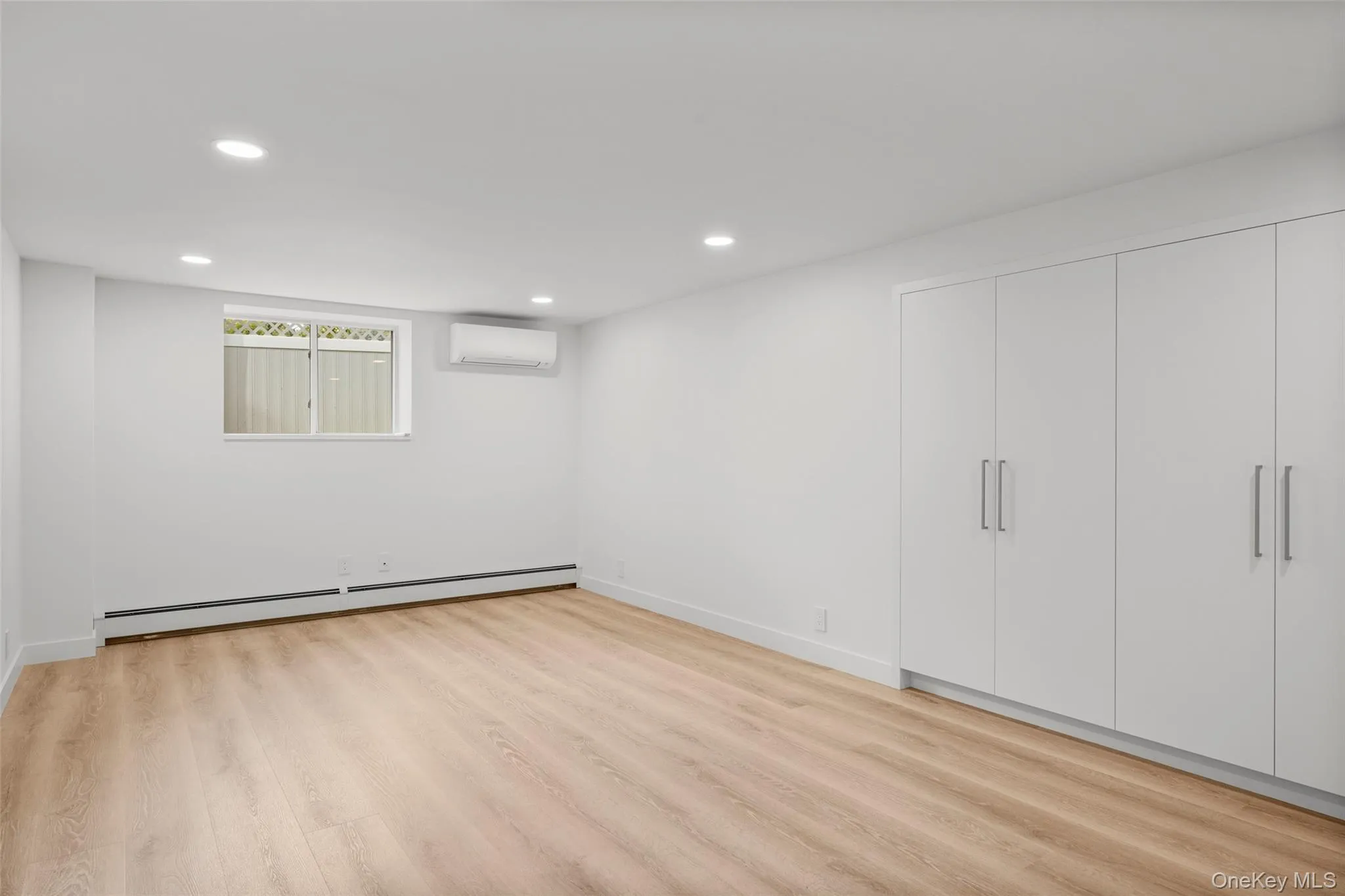 Bonus room on lower level with three large closets Bonus room on lower level with three large closets