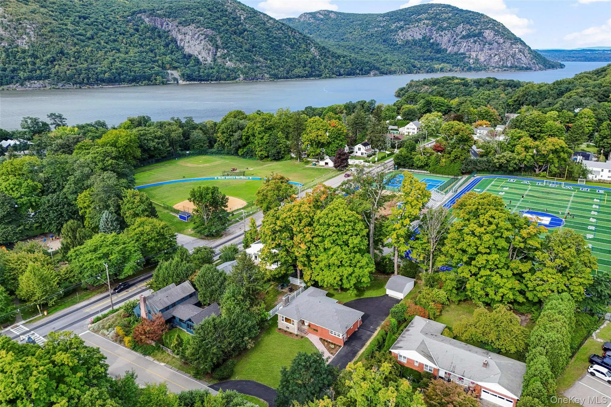 View of the house, sports fields and the Hudson River and the Hudson Highland mountains from the air View of the house, sports fields and the Hudson River and the Hudson Highland mountains from the air