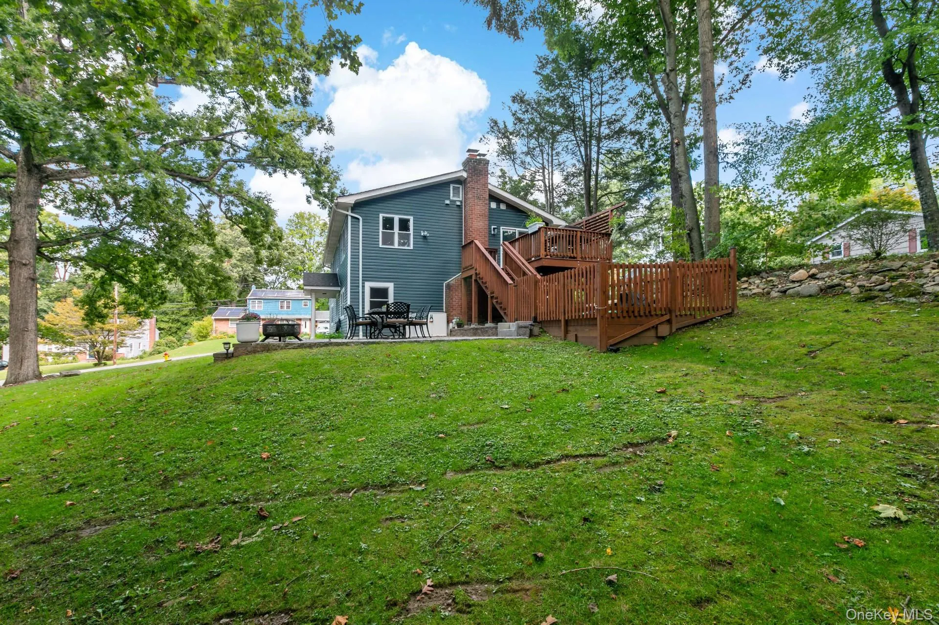 Side view with yard, deck and patio Side view with yard, deck and patio