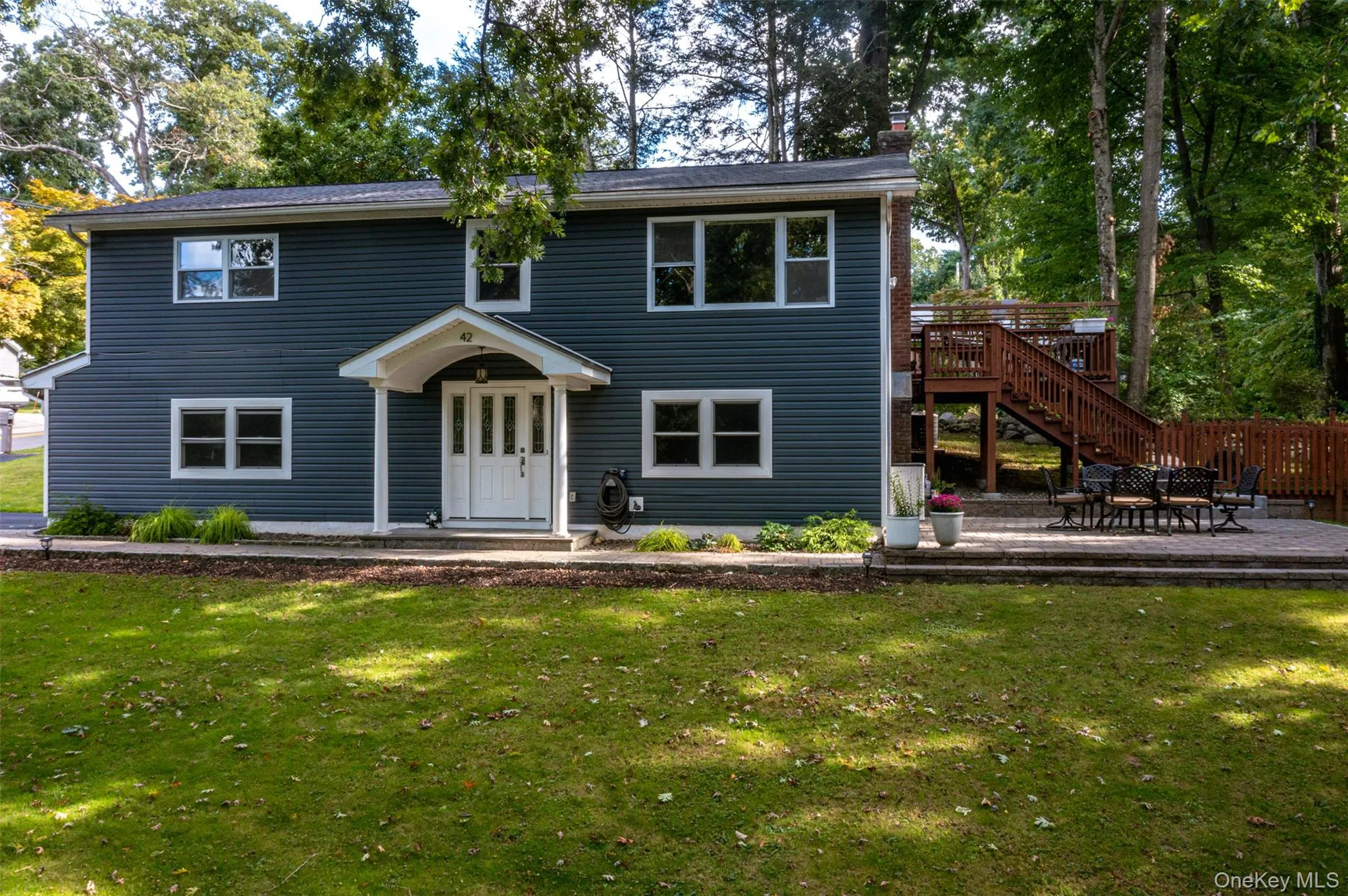 Front exterior of house and side deck and patio Front exterior of house and side deck and patio