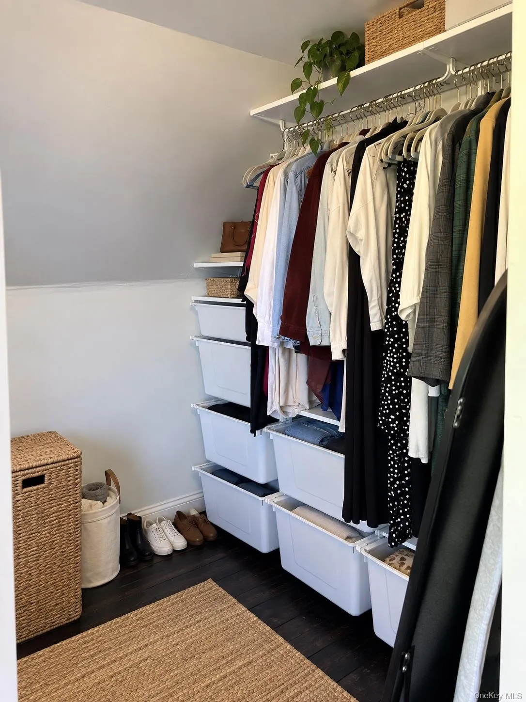 Virtually Staged. Upstairs bedroom suite features a walk-in closet with a full shelving system and built-in drawers. Virtually Staged. Upstairs bedroom suite features a walk-in closet with a full shelving system and built-in drawers.