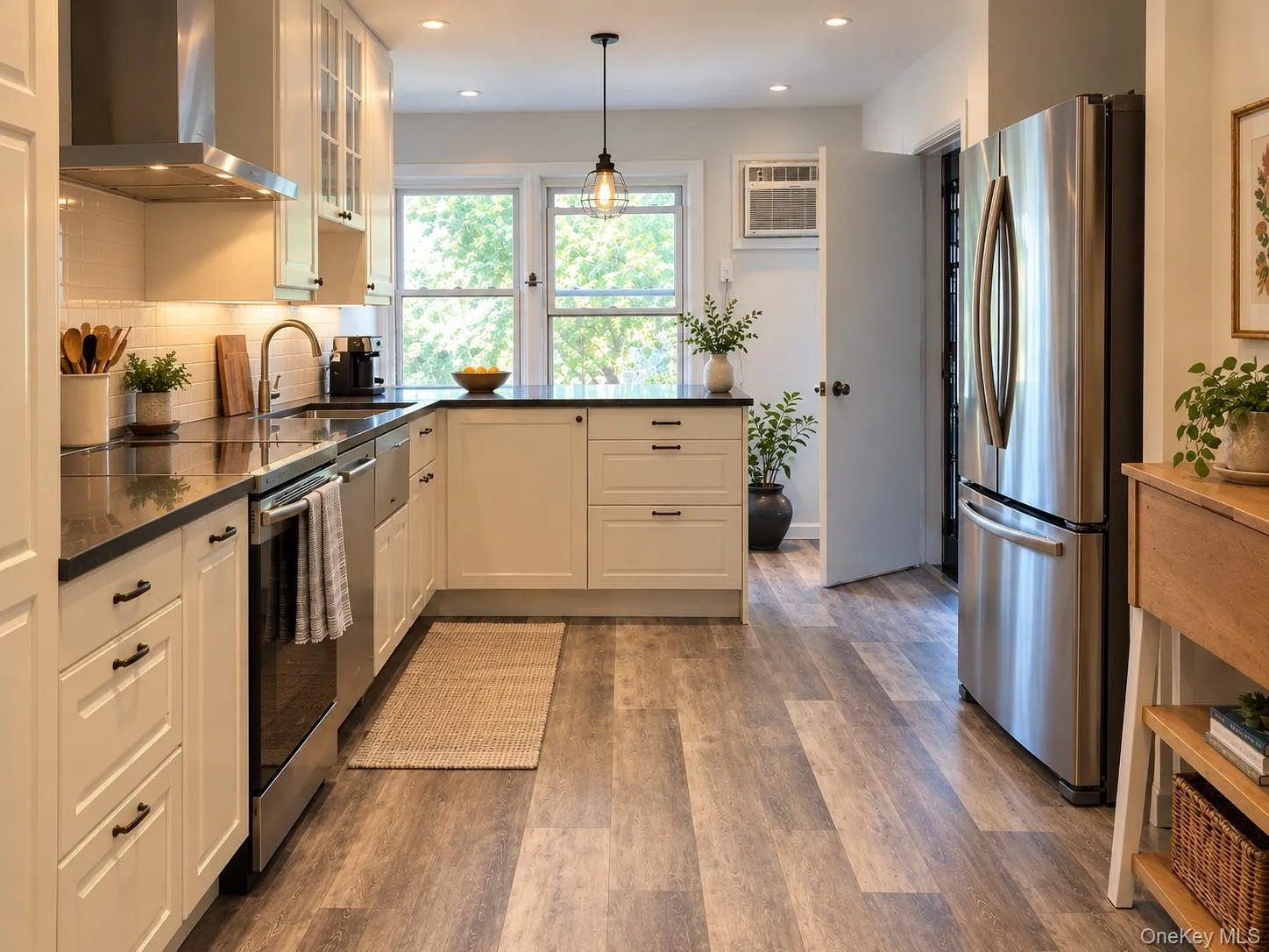 Renovated eat-in Chef's kitchen with stainless steel appliances, room for bar stools and plenty of light. Renovated eat-in Chef's kitchen with stainless steel appliances, room for bar stools and plenty of light.