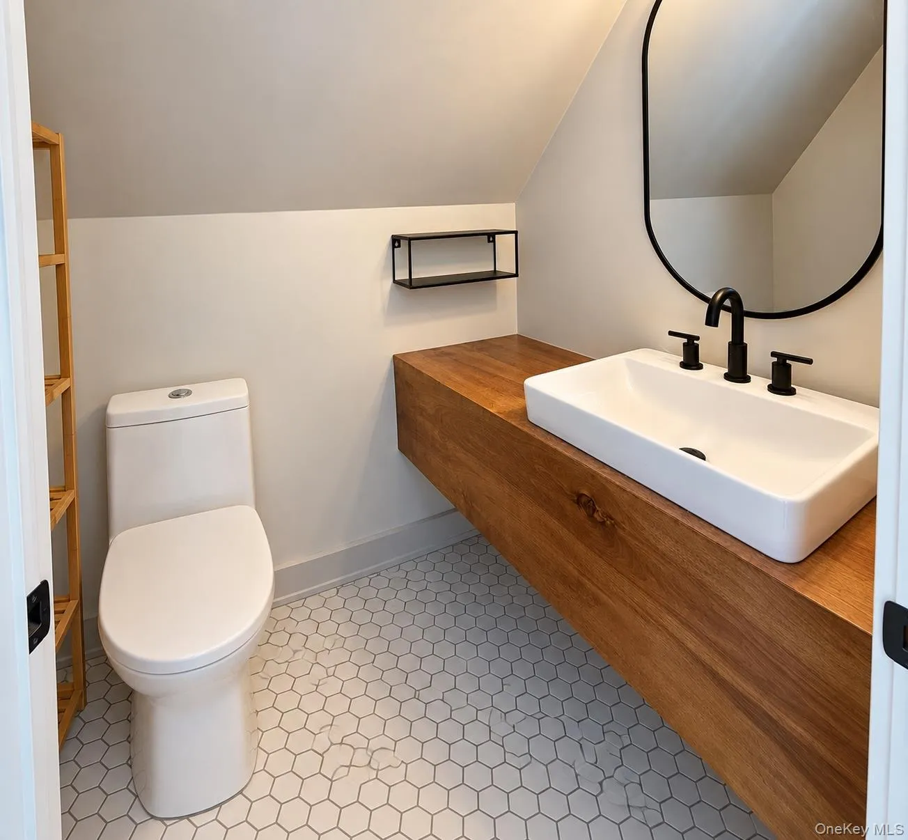Beautifully finished upstairs half bath. Beautifully finished upstairs half bath.