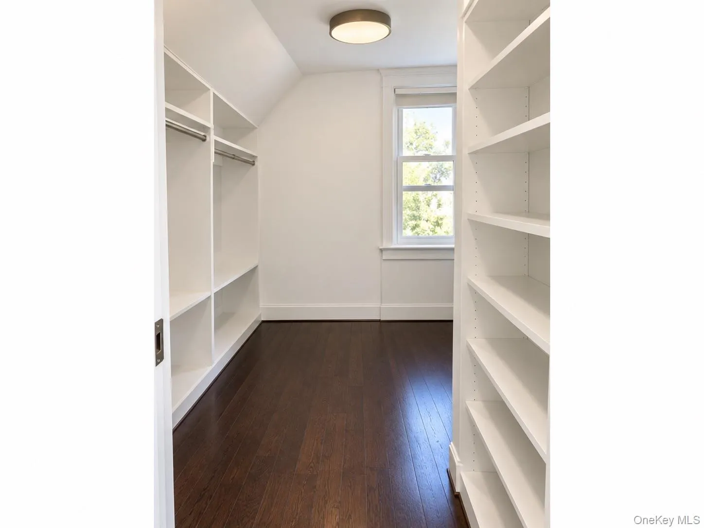 Upstairs bedroom suite features a walk-in closet with a full shelving system and built-in drawers. Upstairs bedroom suite features a walk-in closet with a full shelving system and built-in drawers.