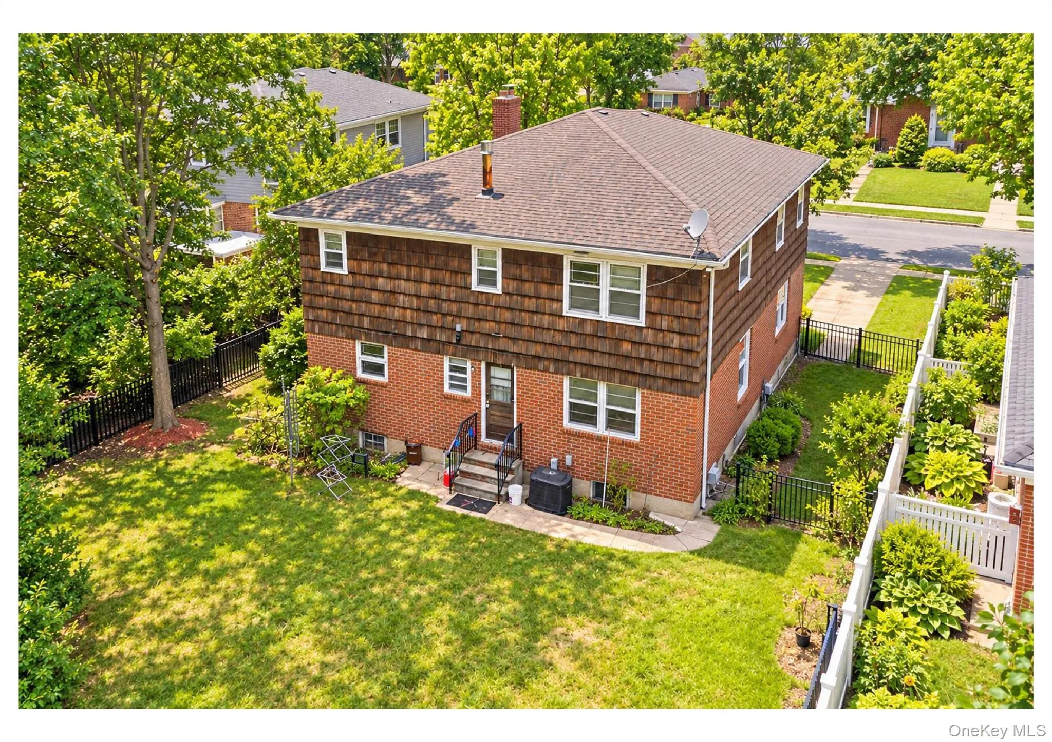 Brick and shingle exterior with a gabled roof Brick and shingle exterior with a gabled roof